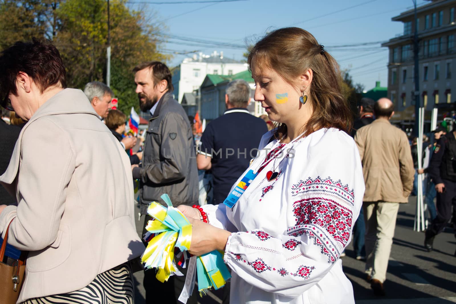 Moscow, Russia - September 21, 2014.  Peace March the girl in the Ukrainian national clothes Peace March in Moscow against war with Ukraine