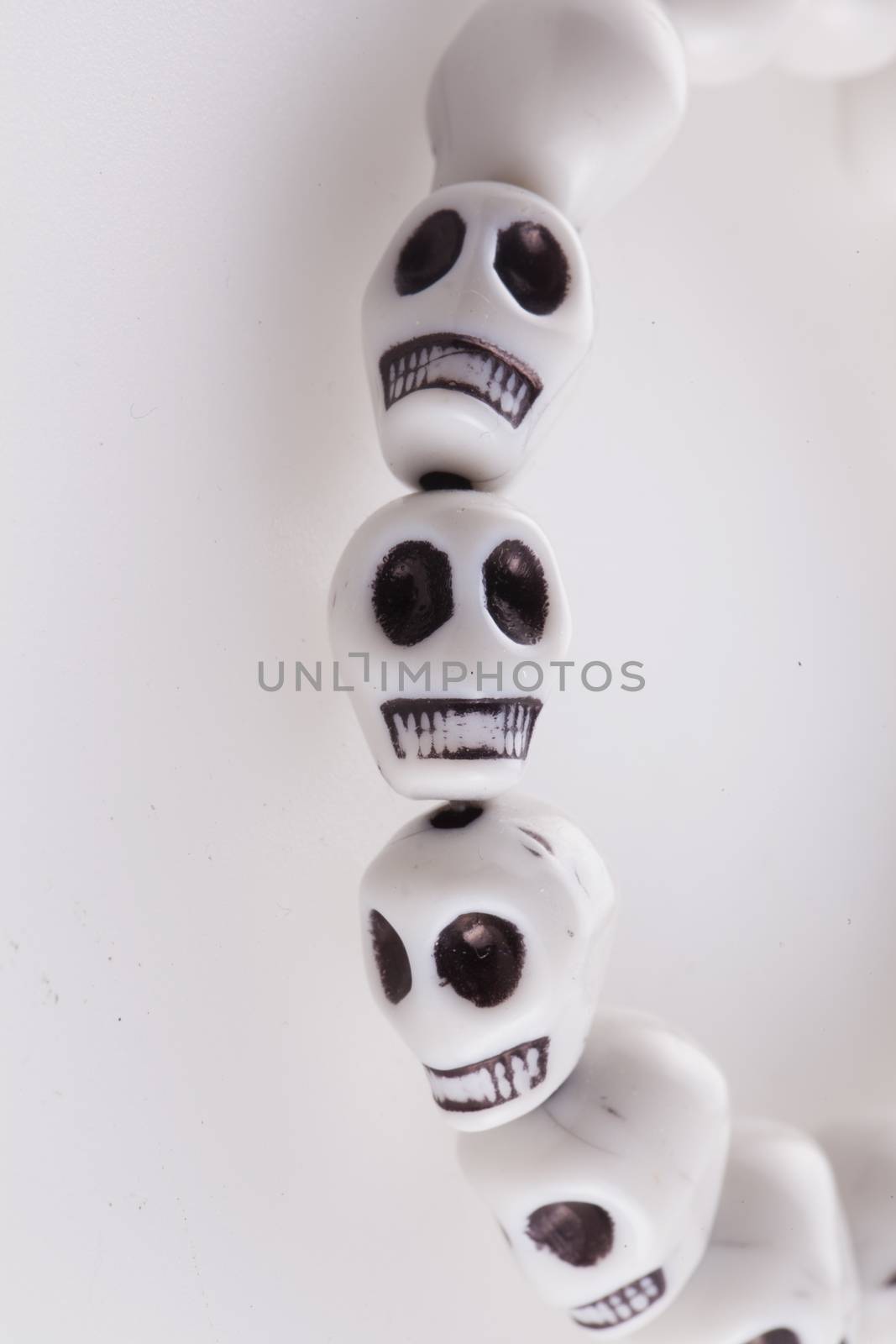 White skull bracelet over a white background