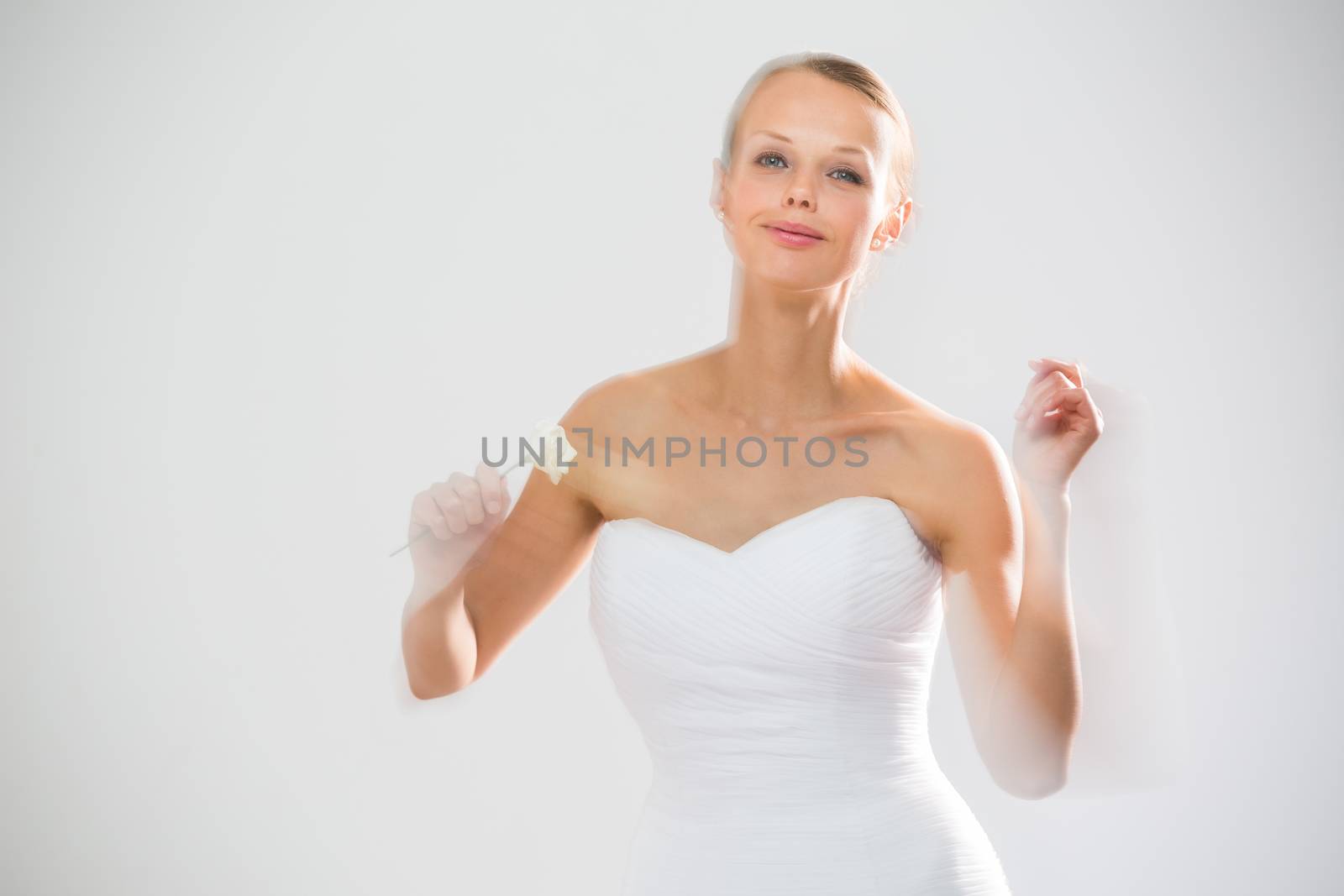 Gorgeous bride dancing, holding a rose by viktor_cap