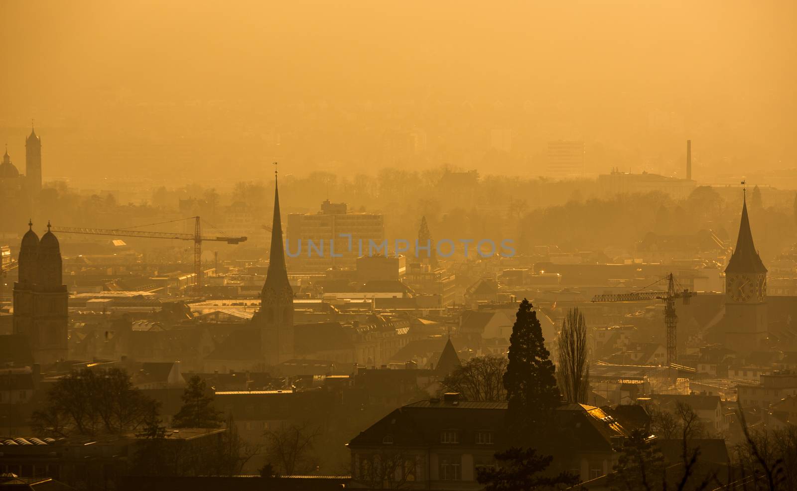 View of Zurich from above - misty winter evening and smoke by viktor_cap