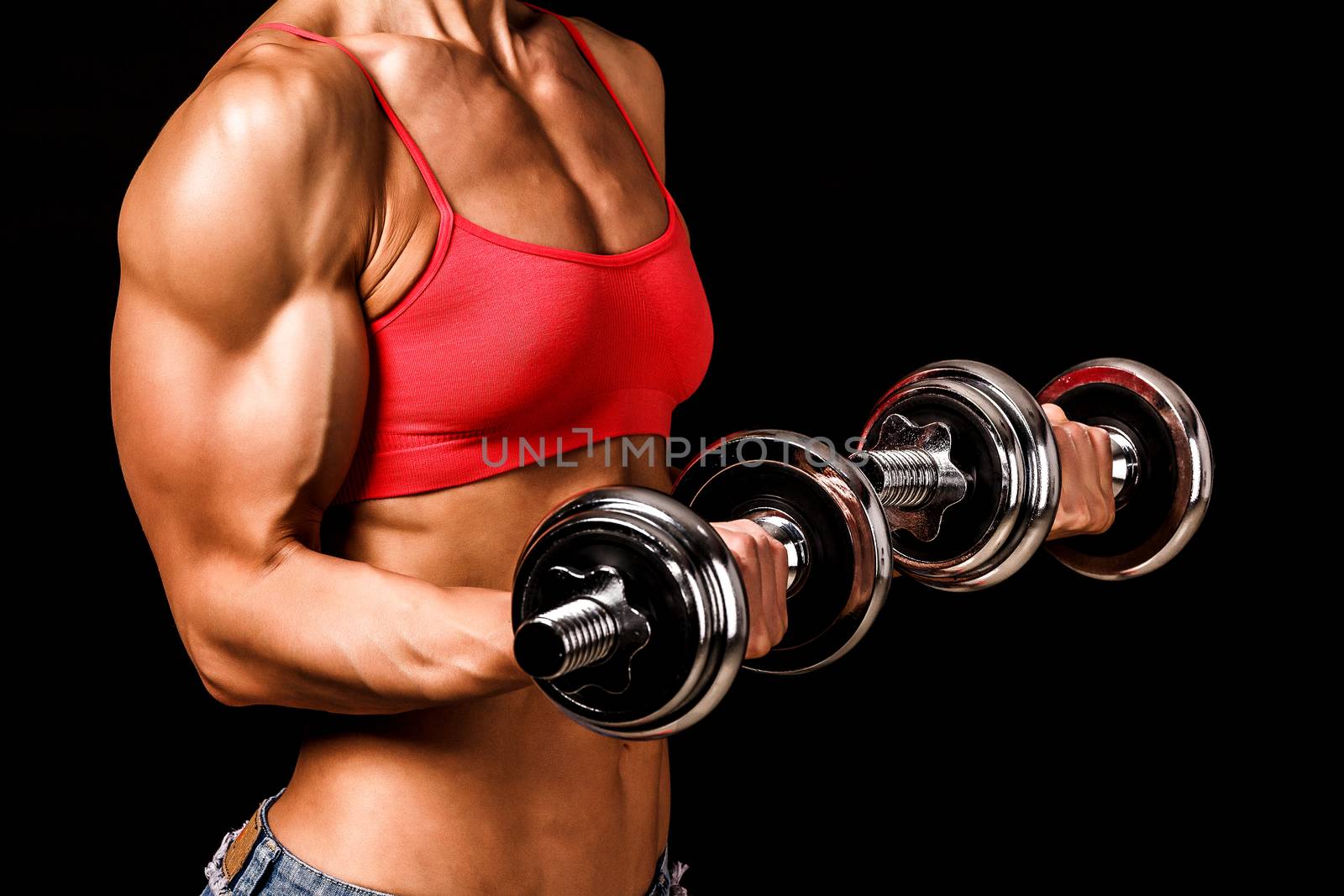 Fit woman with barbells, isolated on black by Nobilior