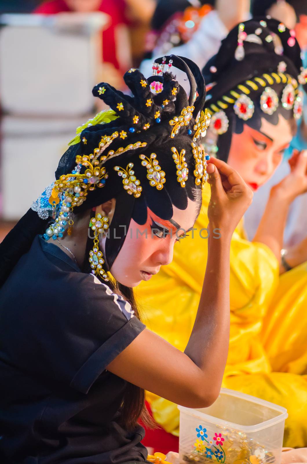 BANGKOK - OCTOBER 22: Unidentified Chinese opera actress applies makeup backstage at Theaters of Thailand's ethnic Chinese in Chinatown on October 27, 2014 in Bangkok, Thailand.