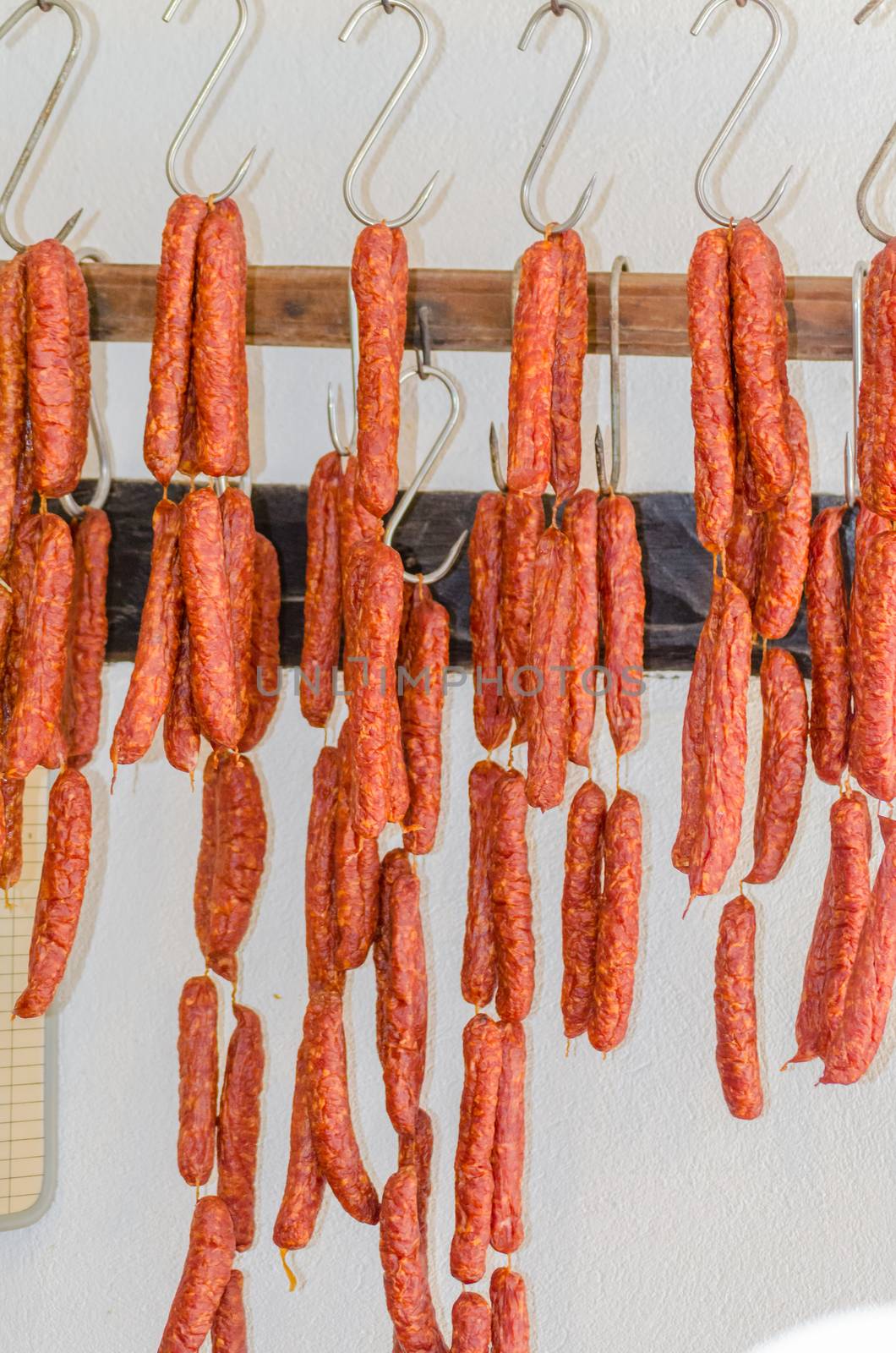 Smoked sausages, meats in butcher's shop. by JFsPic