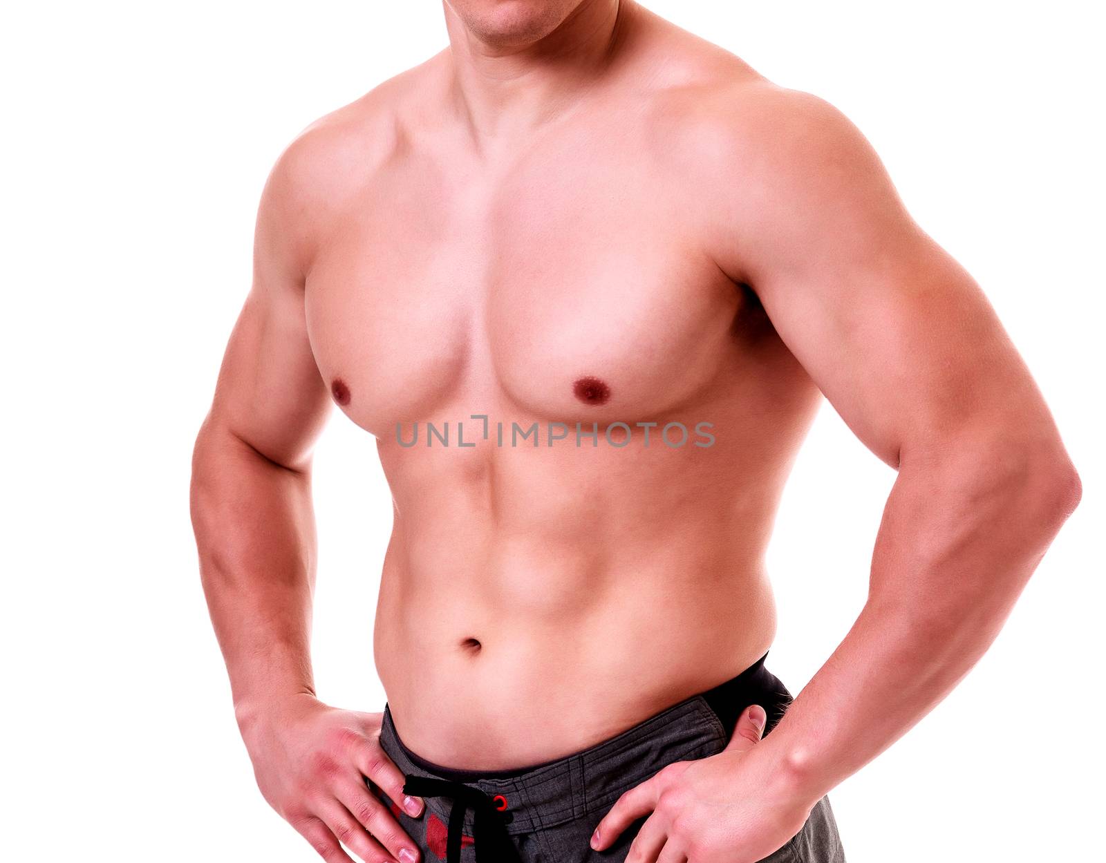 Muscled male against a white background