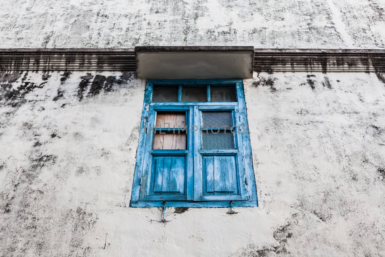 Blue wooden window and grunge wall by juhku