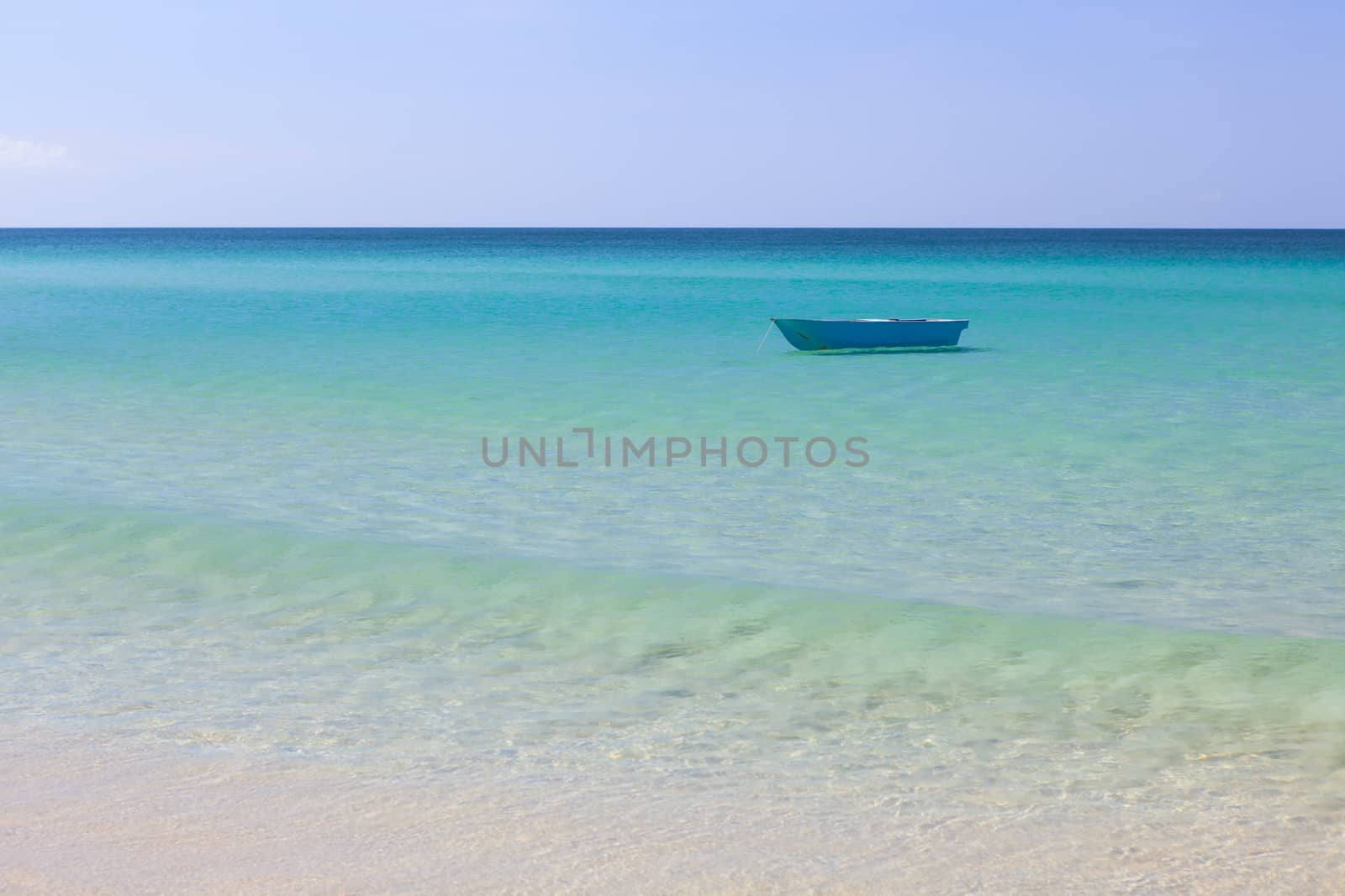 Fisher boat and clear turquoise water at daytime