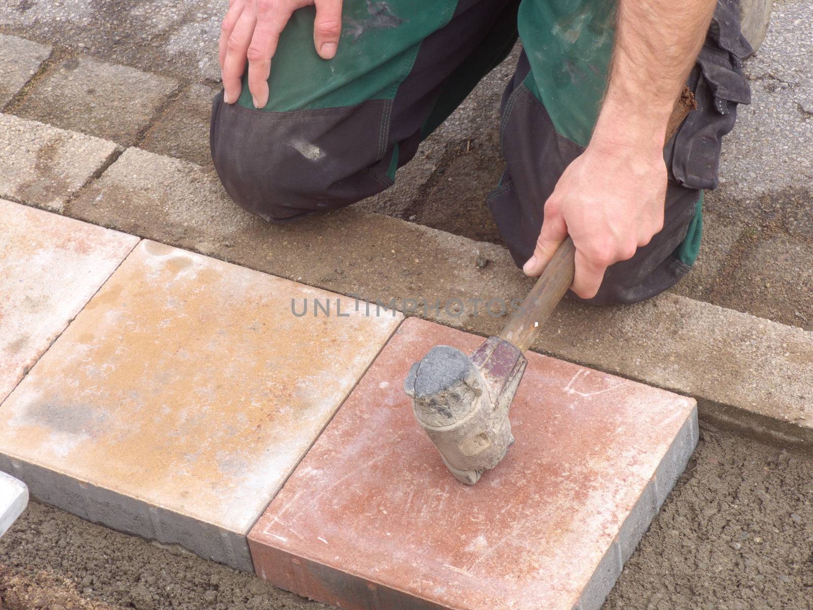Lay paving stones by JFsPic