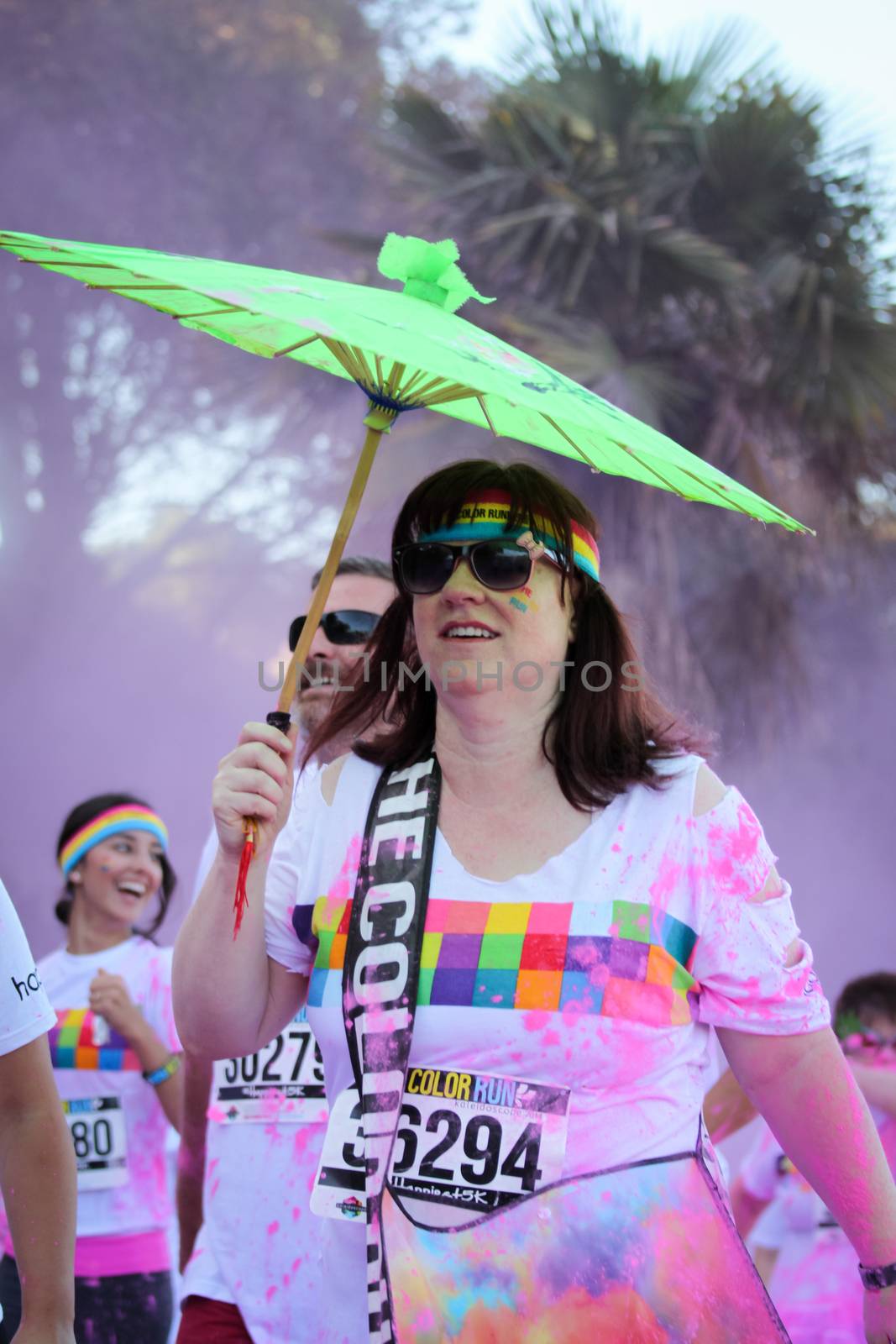 Ventura, CA - OCTOBER 18 : Participants coming through the pink color station at The Color Run 2014 in Ventura. OCTOBER 18, 2014 in Ventura, CA.