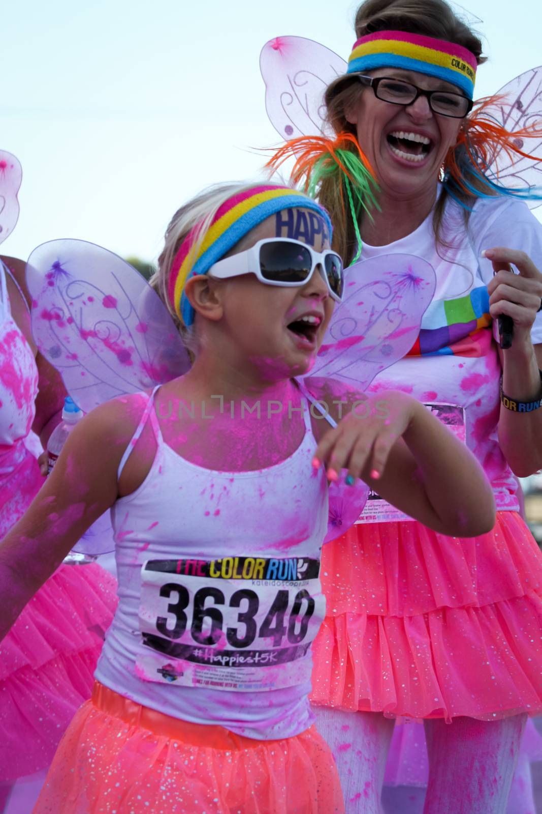 Ventura, CA - OCTOBER 18 : Participants coming through the pink color station at The Color Run 2014 in Ventura. OCTOBER 18, 2014 in Ventura, CA.