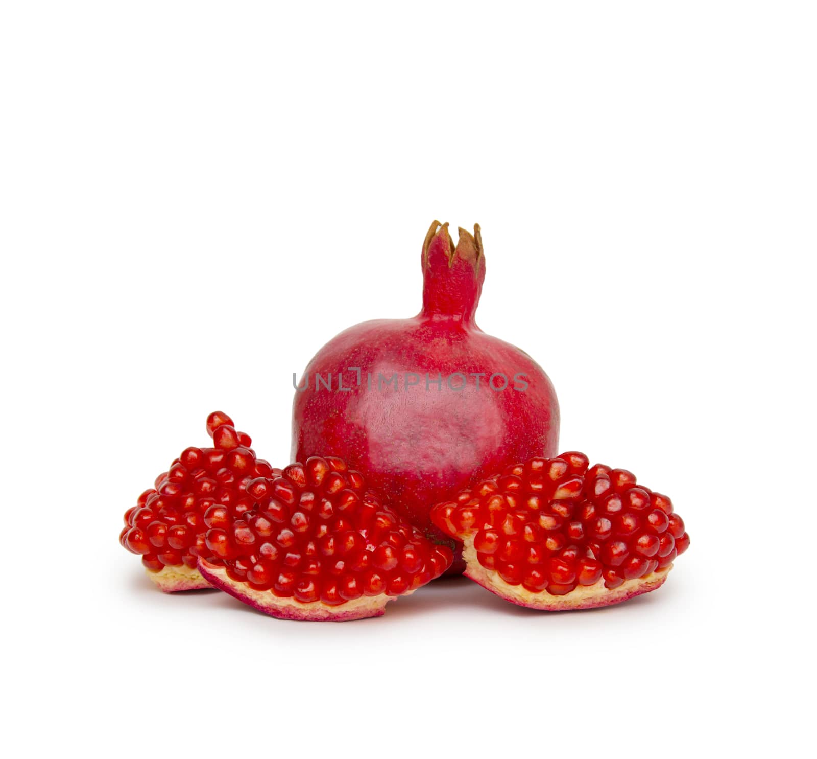 Ripe pomegranate fruit isolated on white background cutout