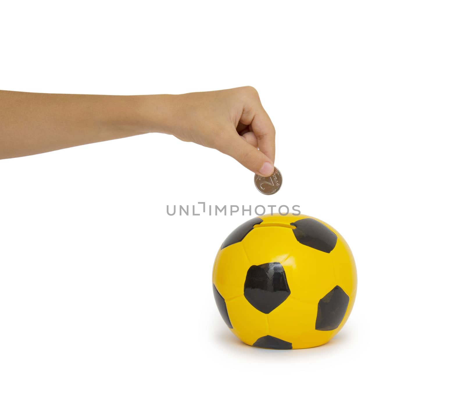 Closeup of woman's hand inserting coin in moneybox