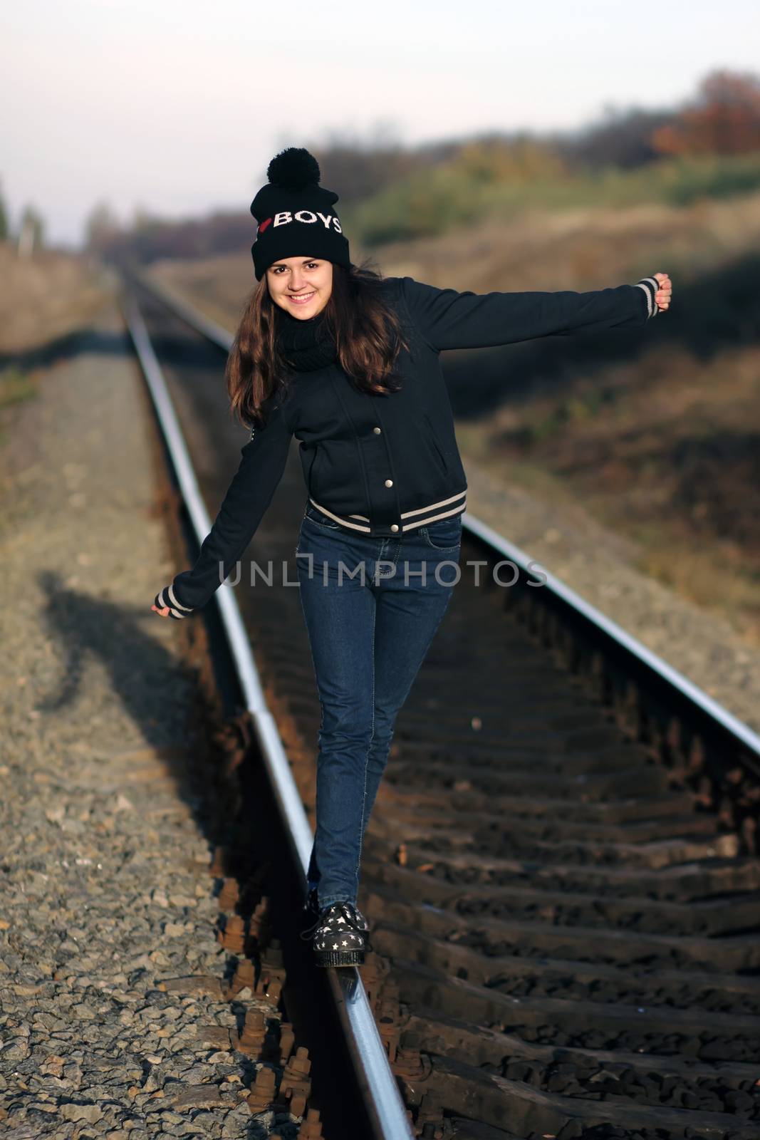 Girl walking along the old rails by scherbinator