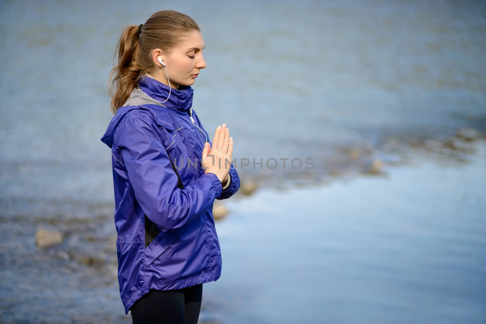 Young Beautiful Woman Meditate on the River by maxpro
