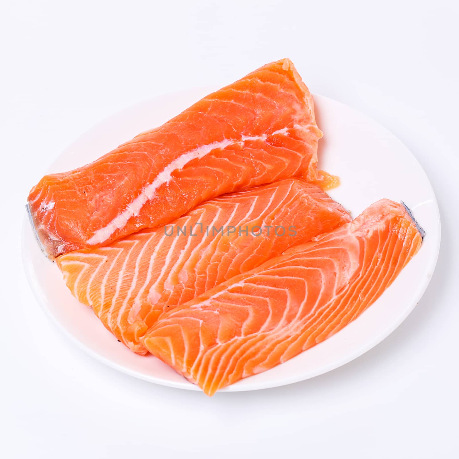 Slice of raw salmon by rufatjumali