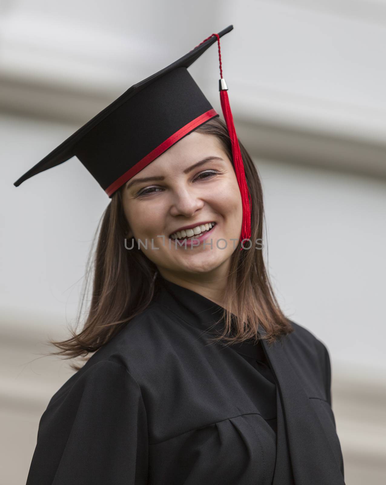 Portrait of a smiling beautiful young woman in the graduation day.