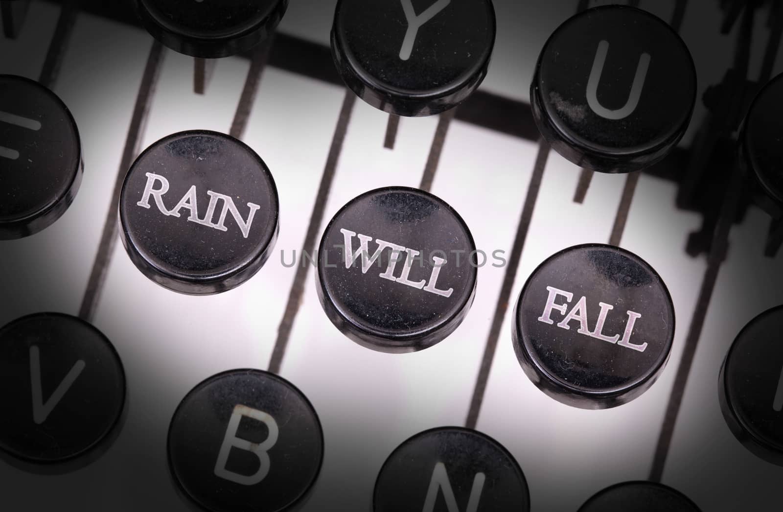 Typewriter with special buttons, rain will fall