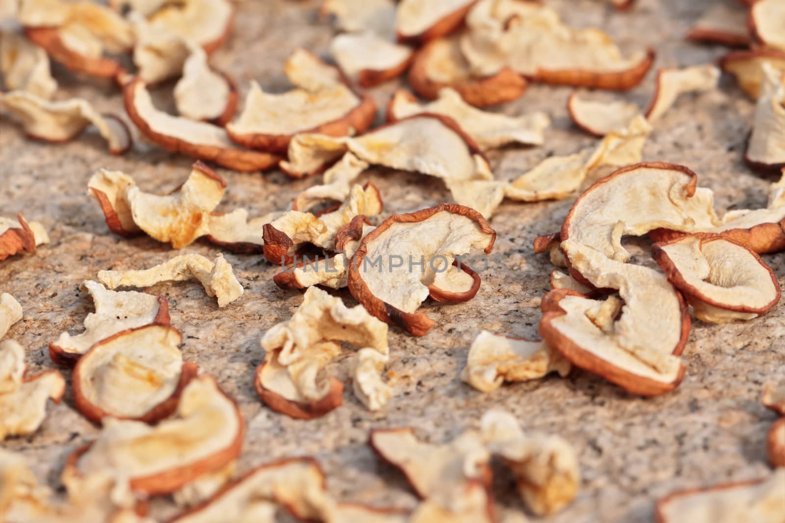 Sun drying sliced apples with selected focus