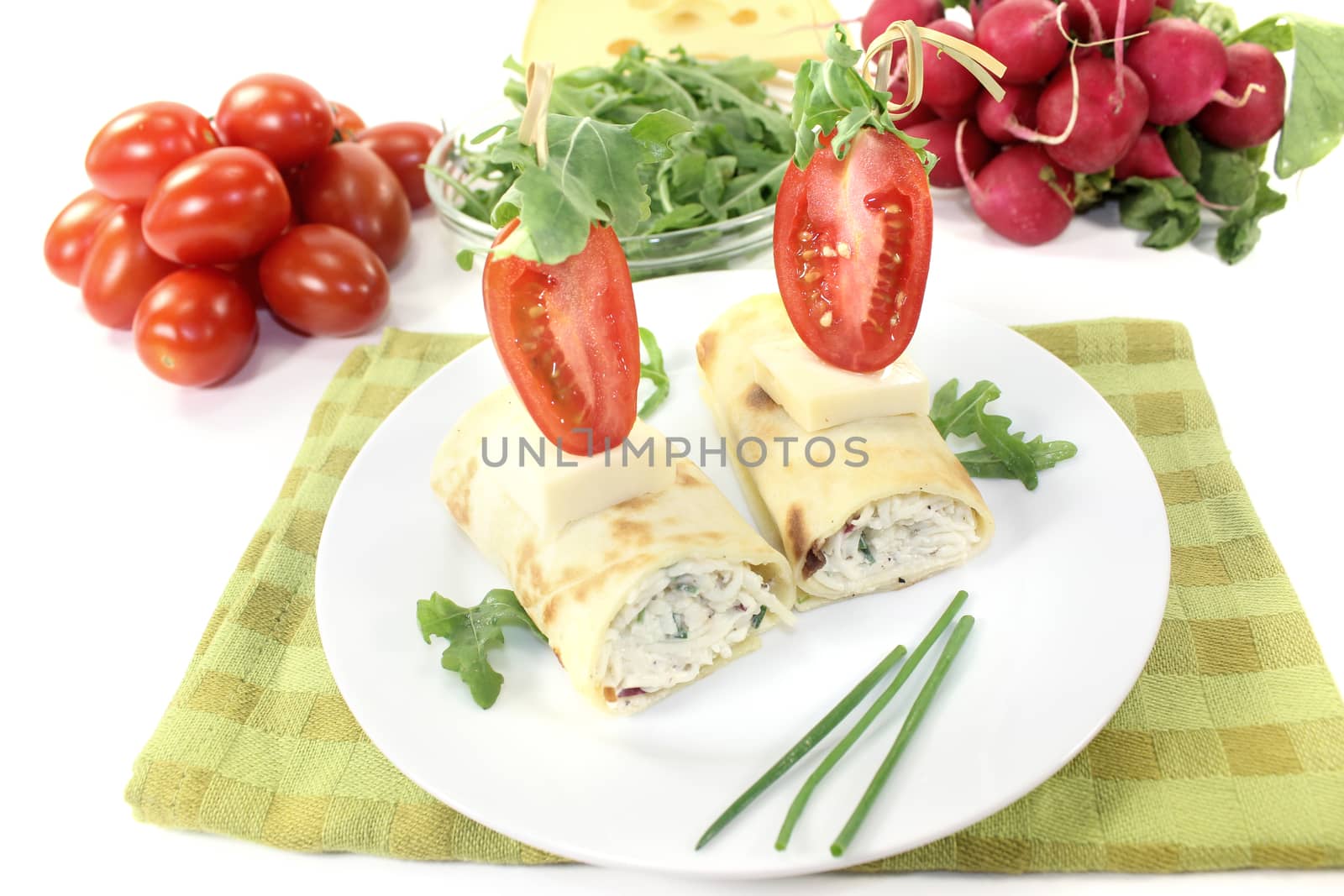 stuffed cheese crepe rolls on a light background