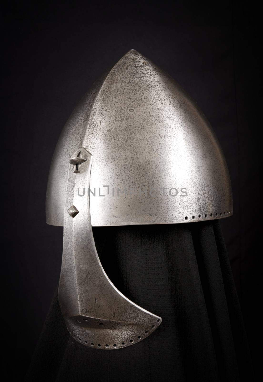 Iron helmet of the medieval knight. Very heavy headdress.