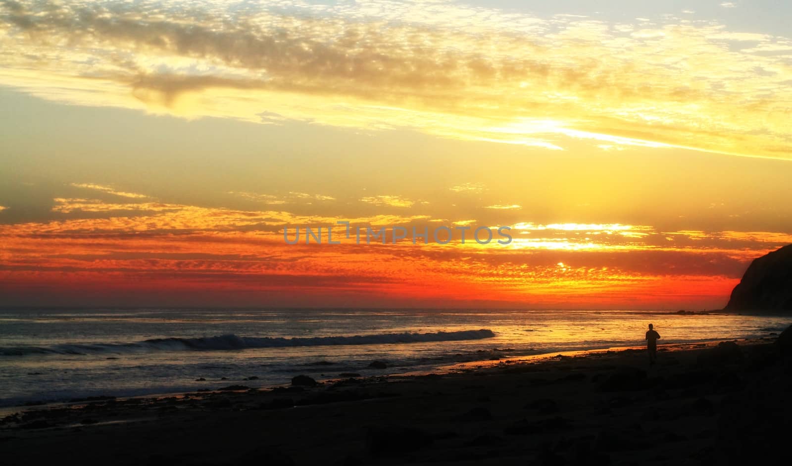 Beautiful sunset at Shoreline beach with cloudy sky.