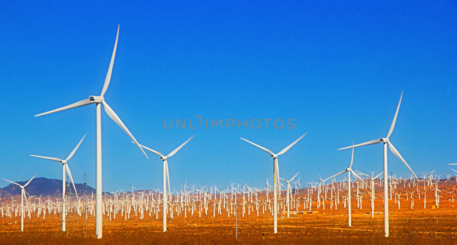 Wind turbine with blue sky by Timmi