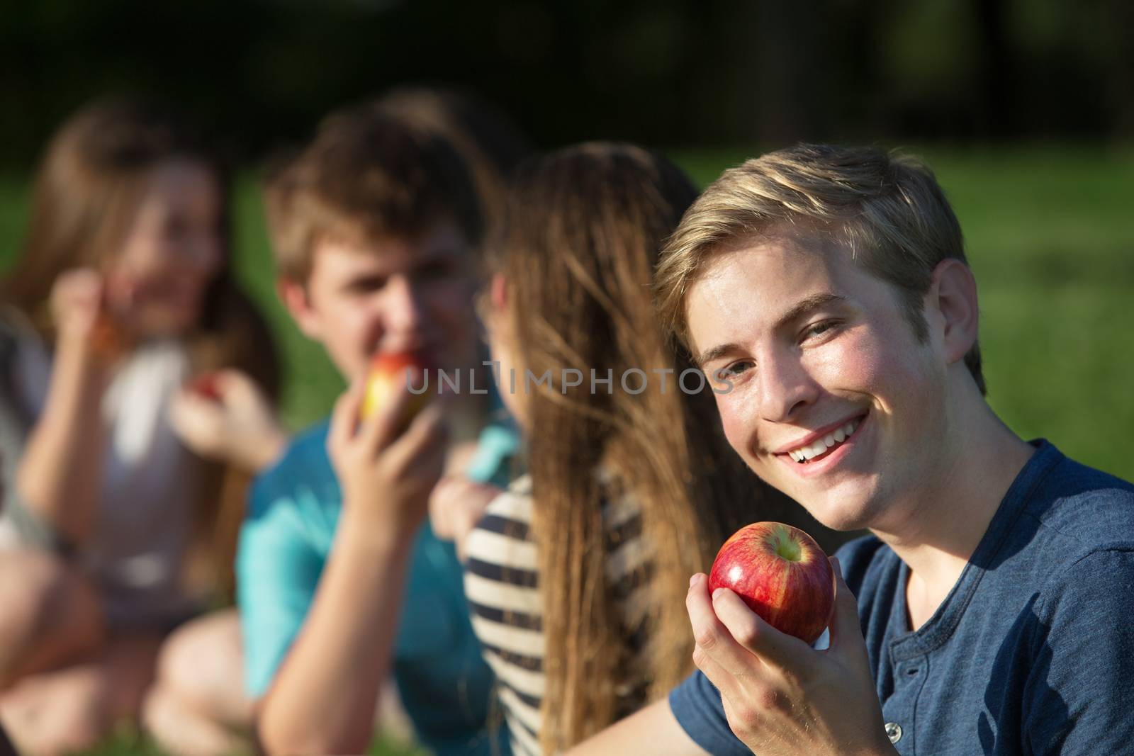 Happy Youth with Apple by Creatista