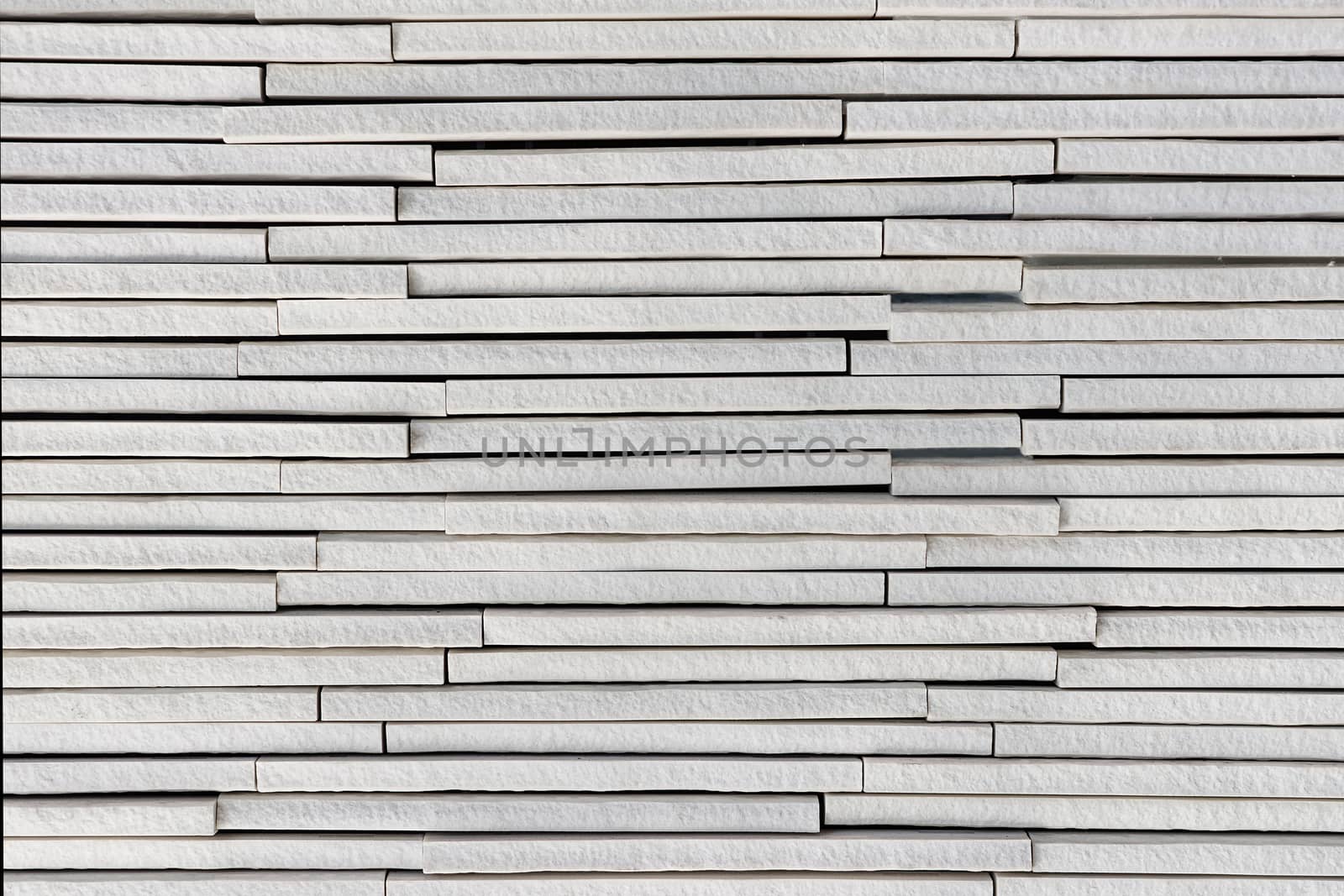 Light grey or white stone plates layers rough textured background