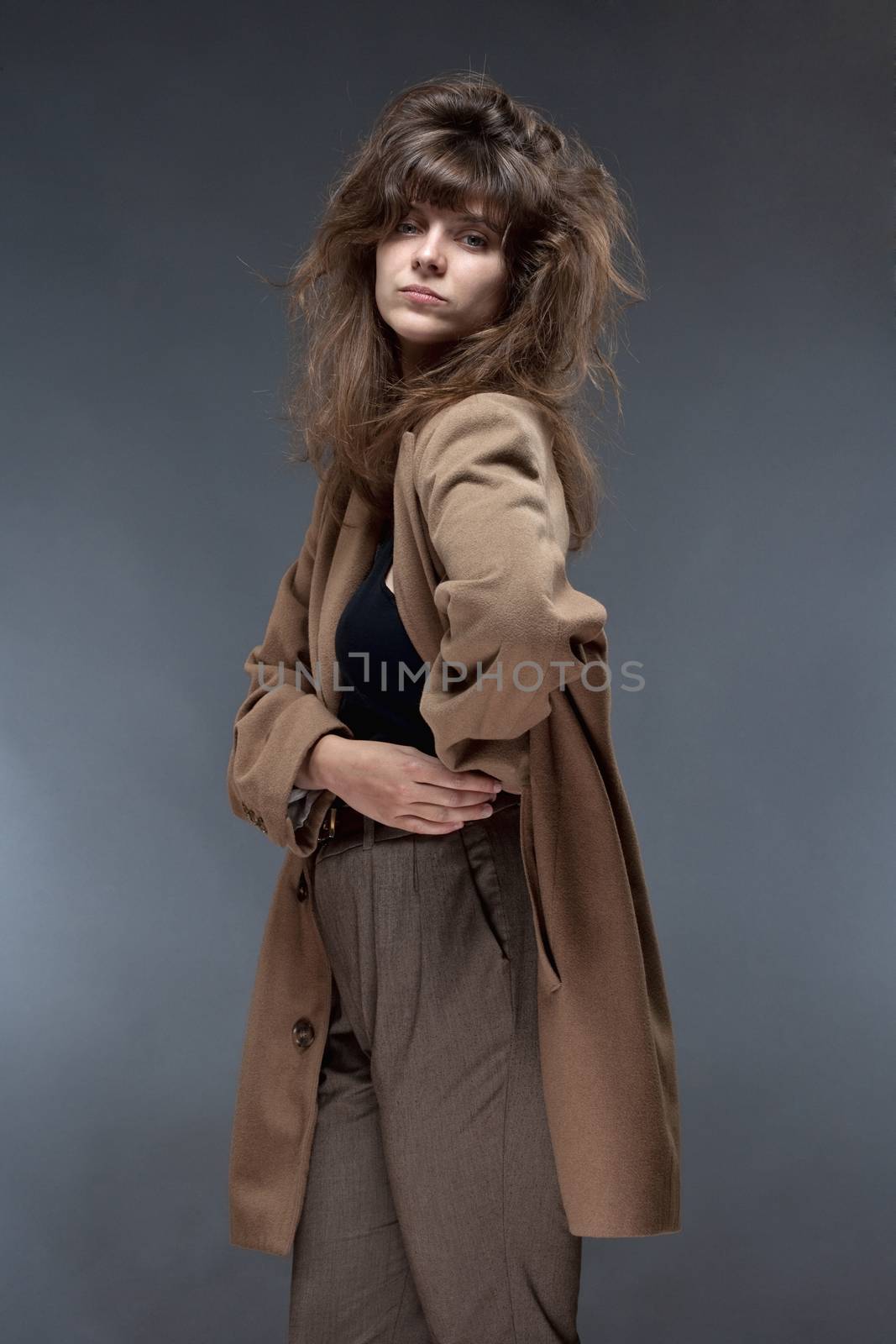 Portrait of a Young Woman in Brown Coat