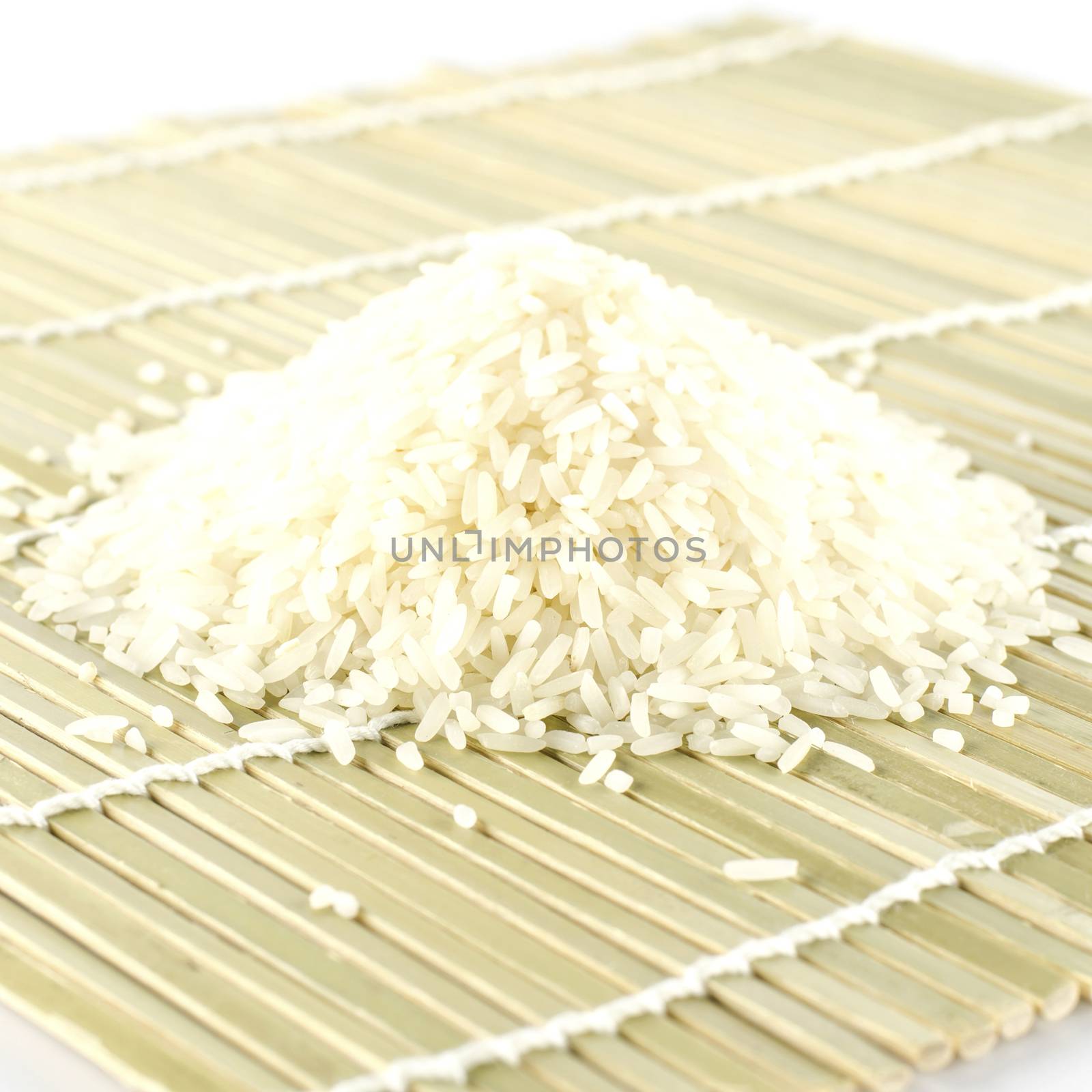 uncooked rice on wooden pad