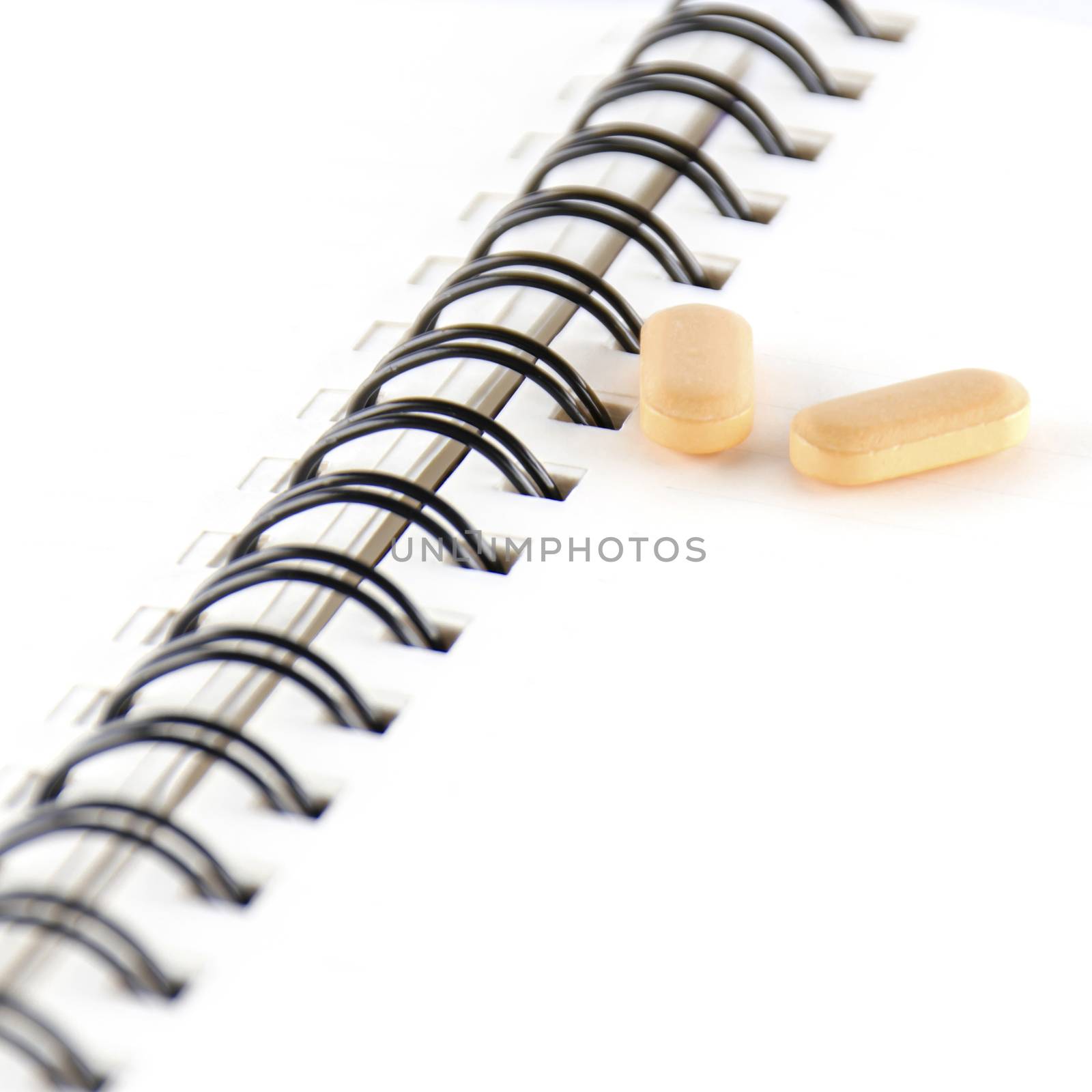 two pills on notebook concept seriousness