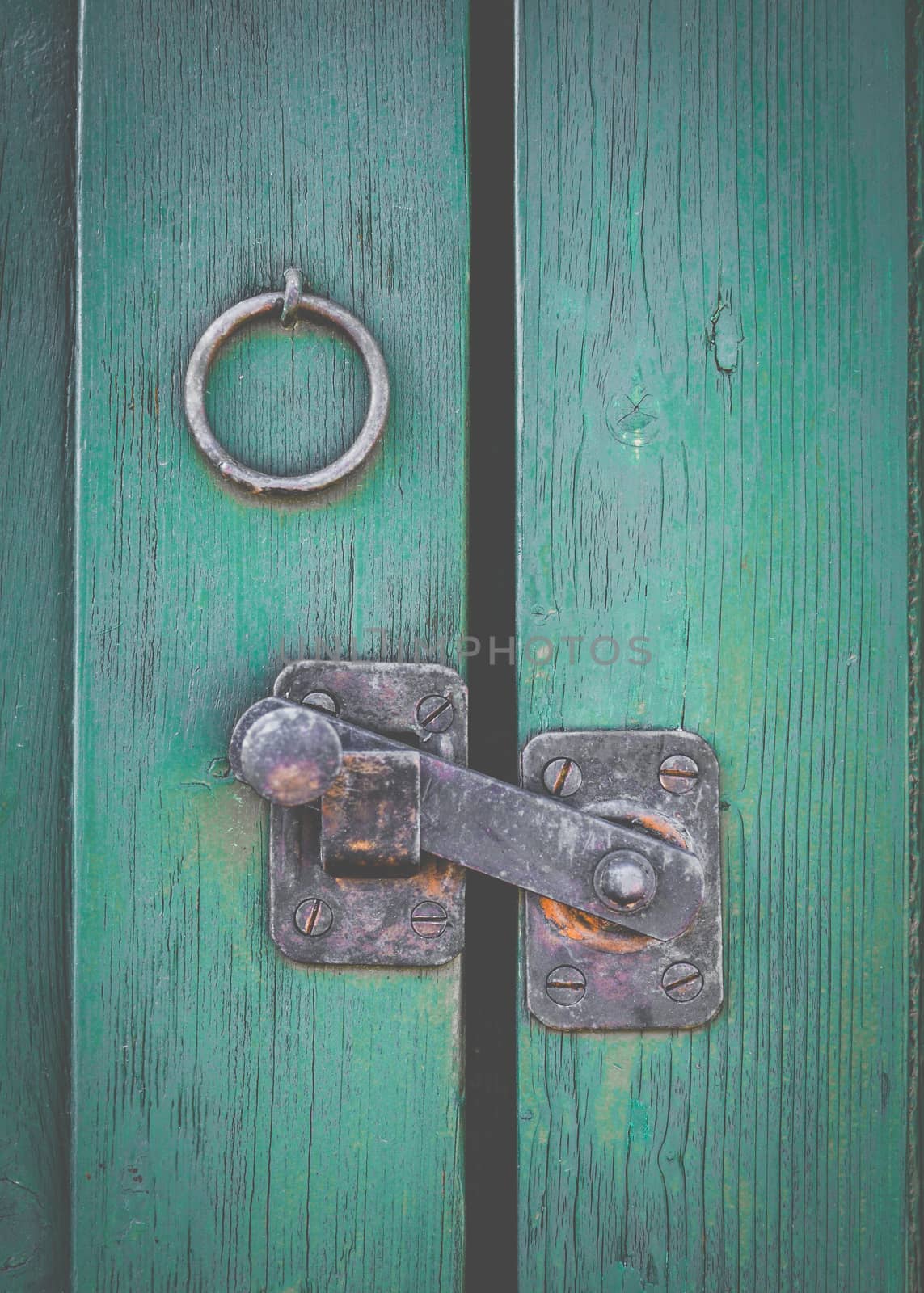 Retro Filtered Photo Of A Rustic Door Latch