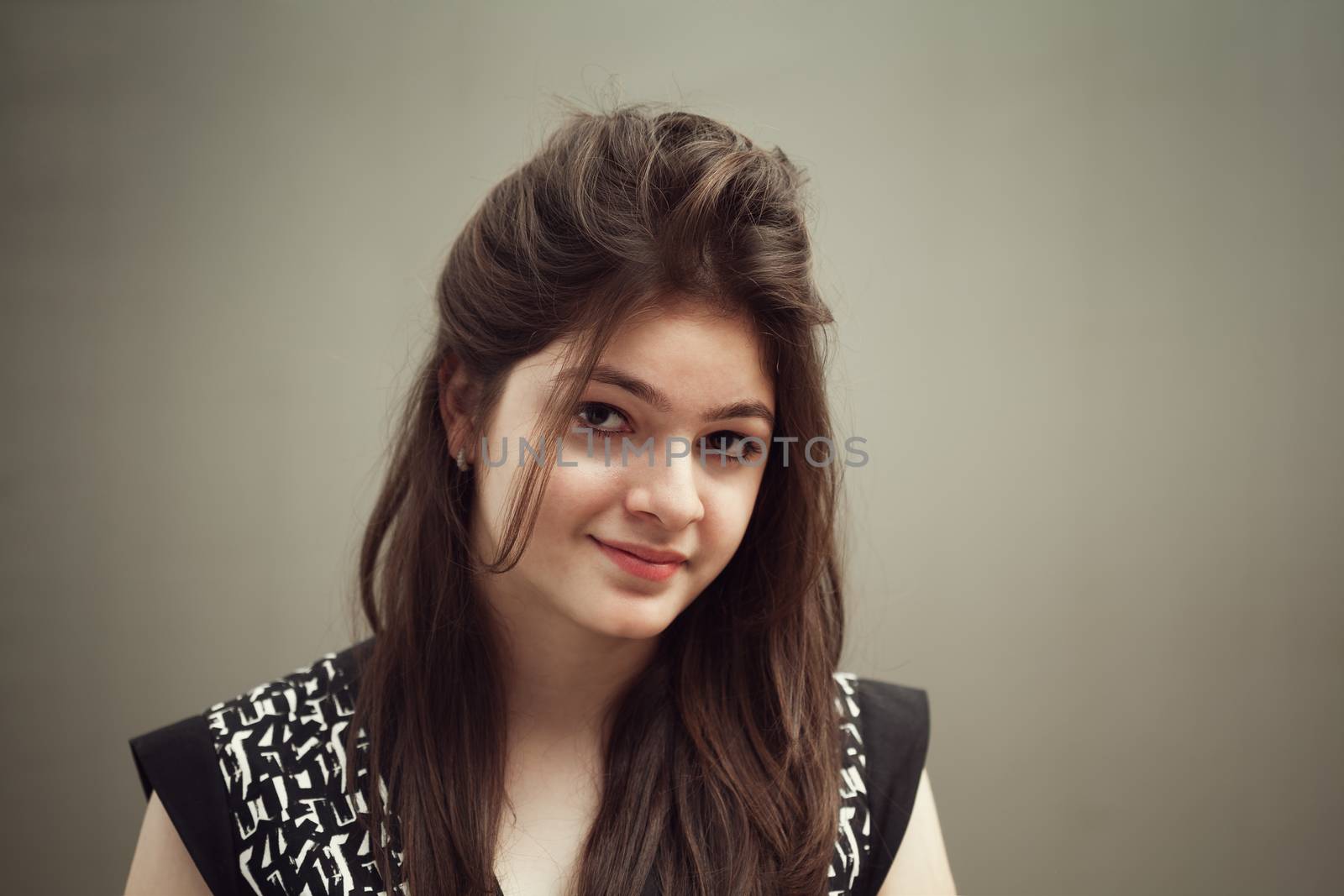 Portrait of indian young female beauty smiling in black and white dress.