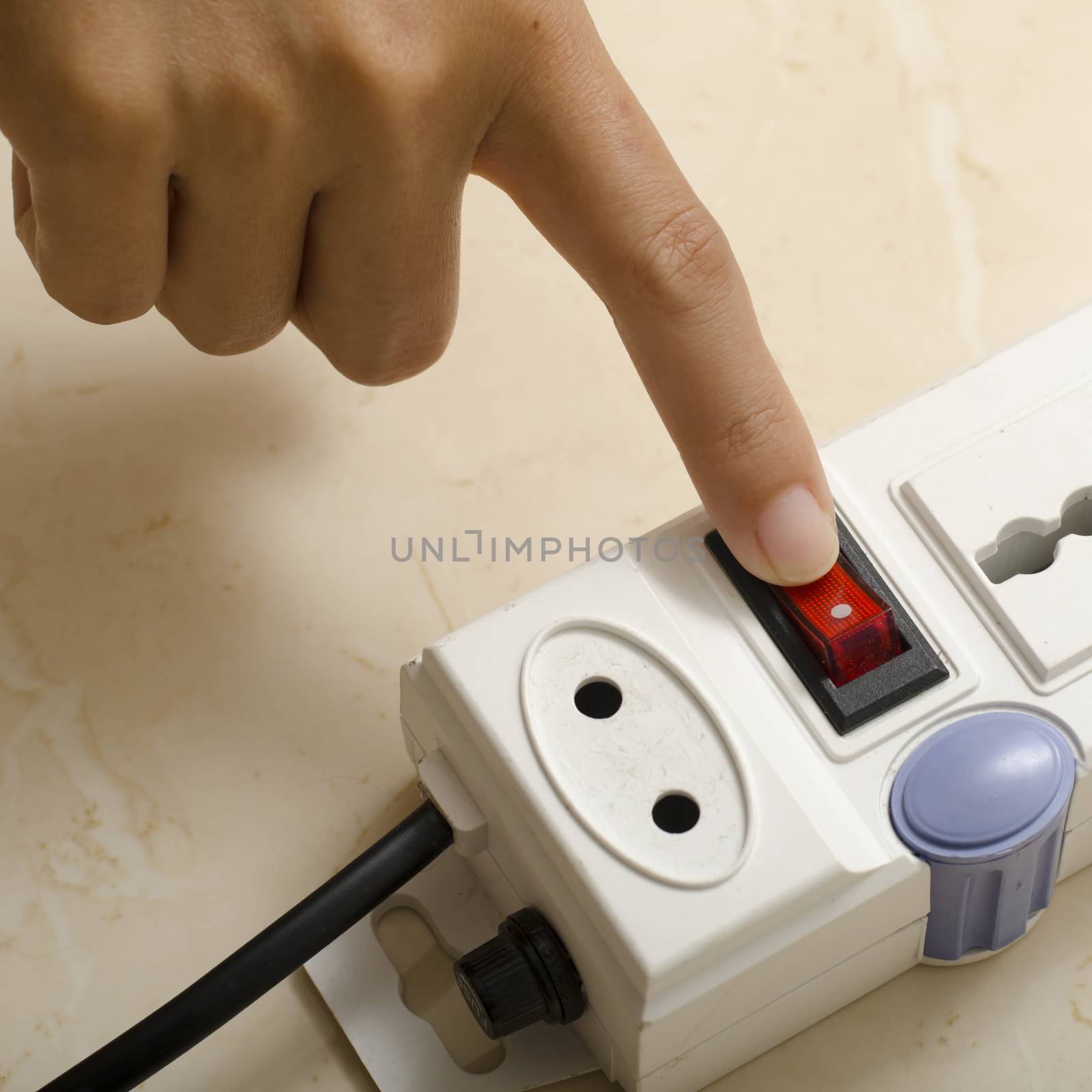 asia woman hand turn on switch multiple  socket plug electric