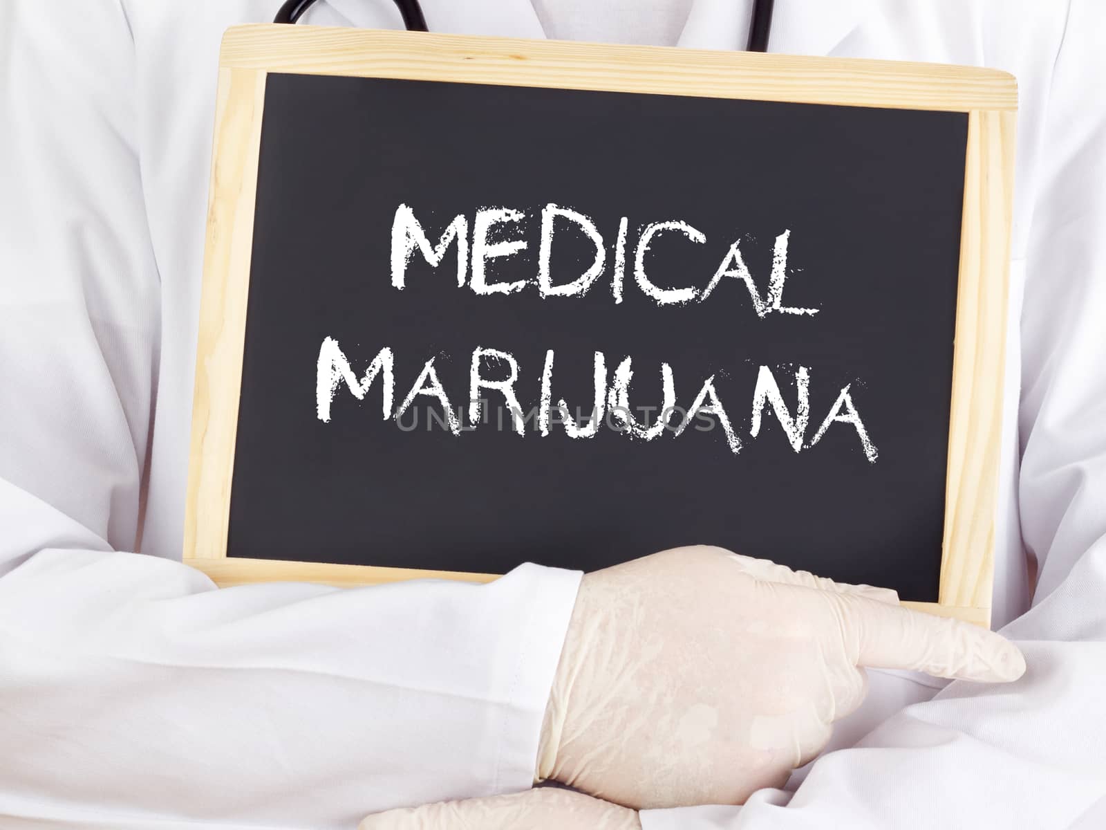 Doctor shows information on blackboard: medical marijuana