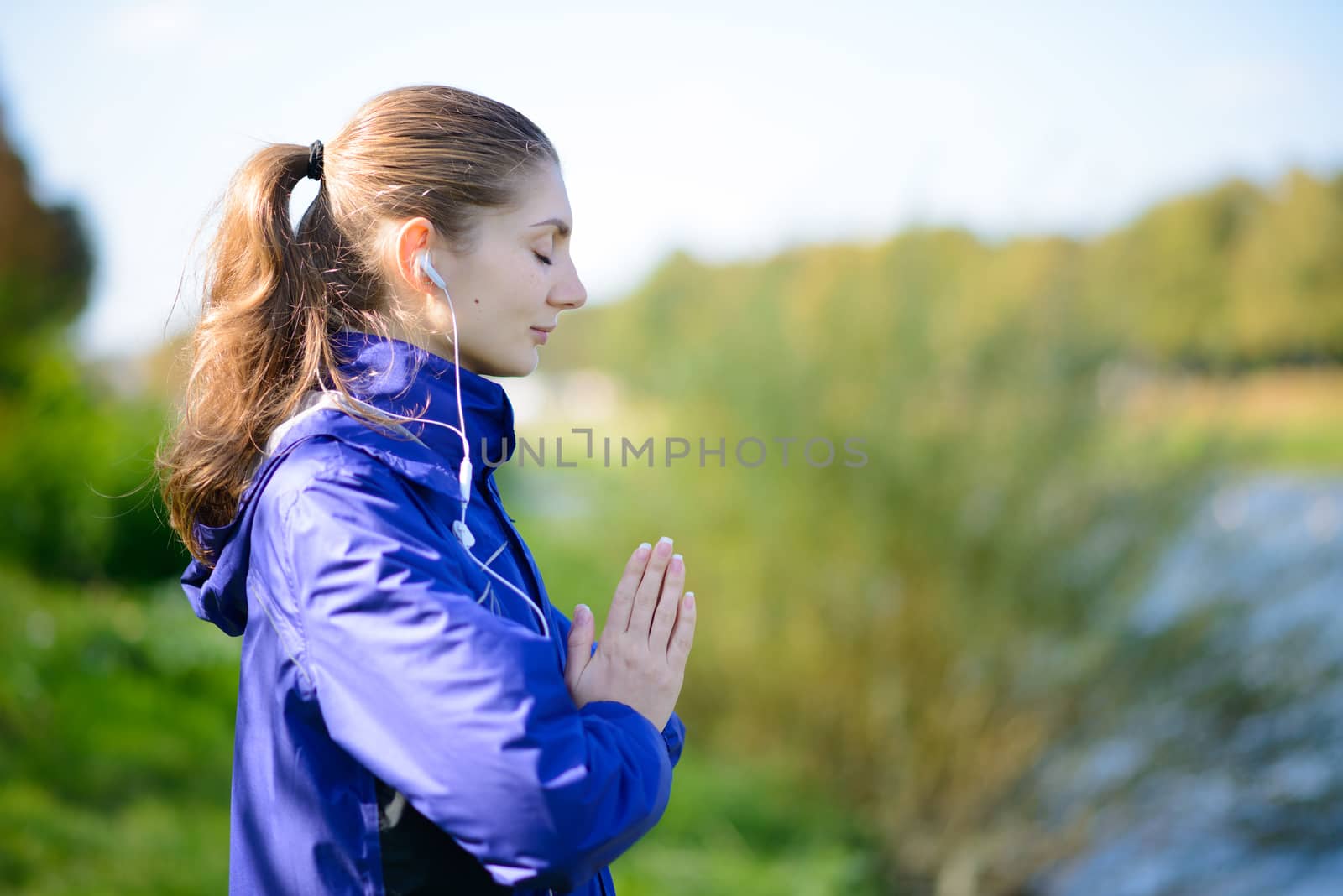 Young Beautiful Woman Meditate on the River by maxpro