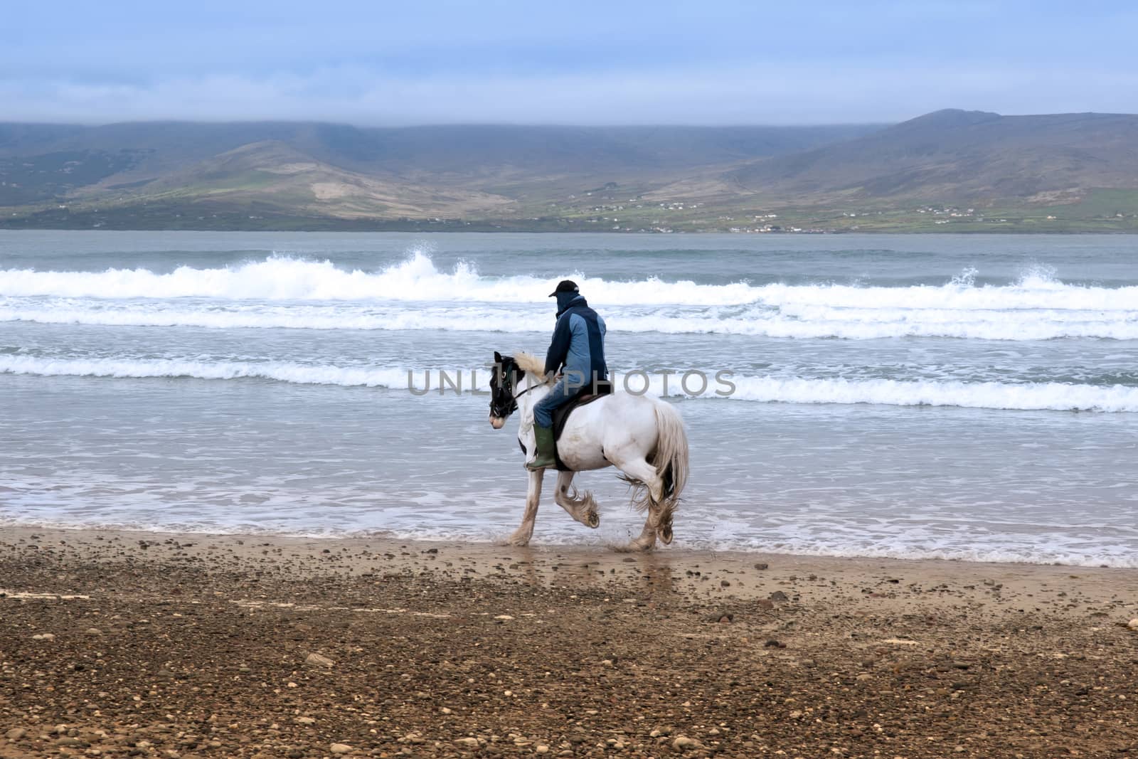 horse and rider at the maharees a beautiful beach in county Kerry Ireland