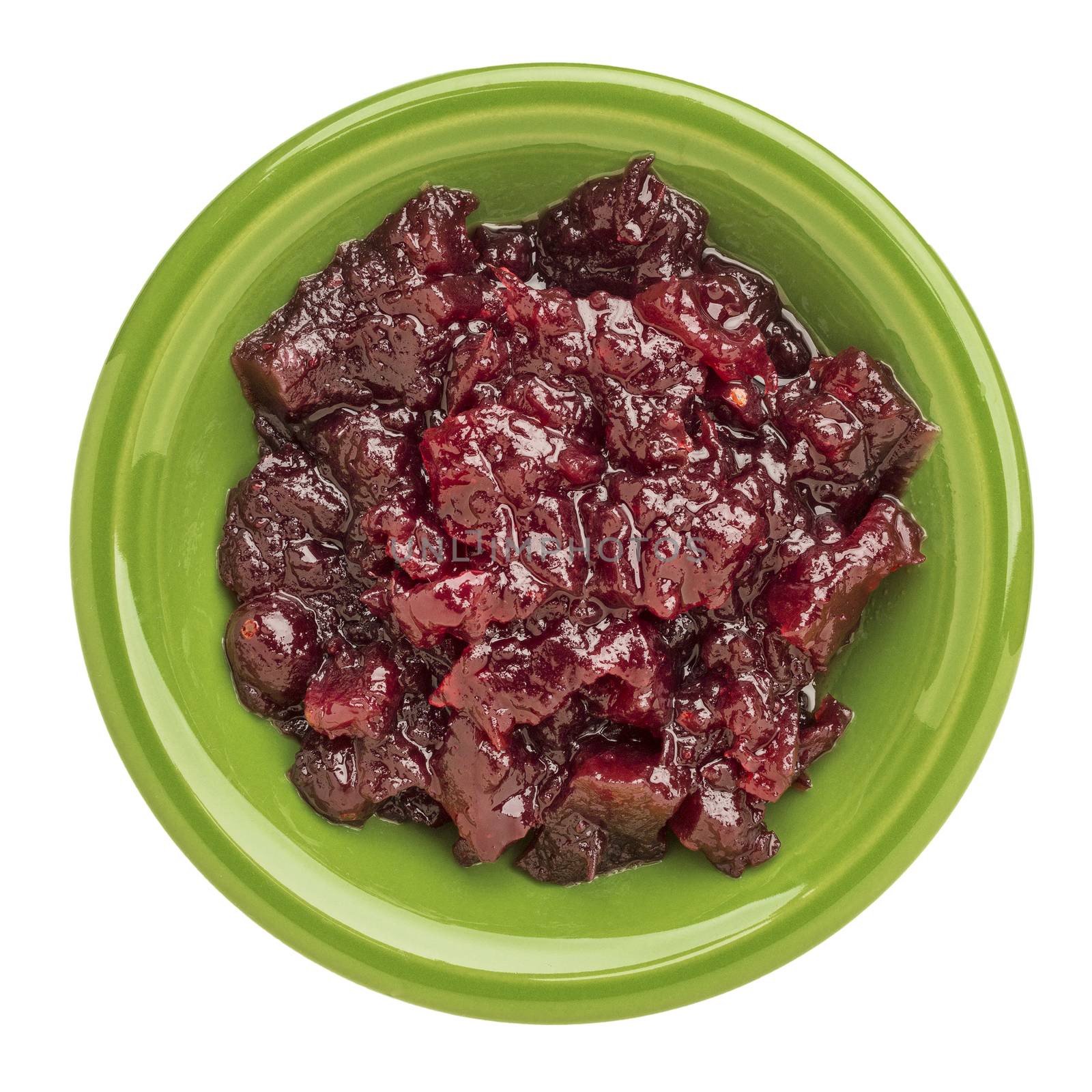 whole fruit cranberry sauce on an isolated green bowl
