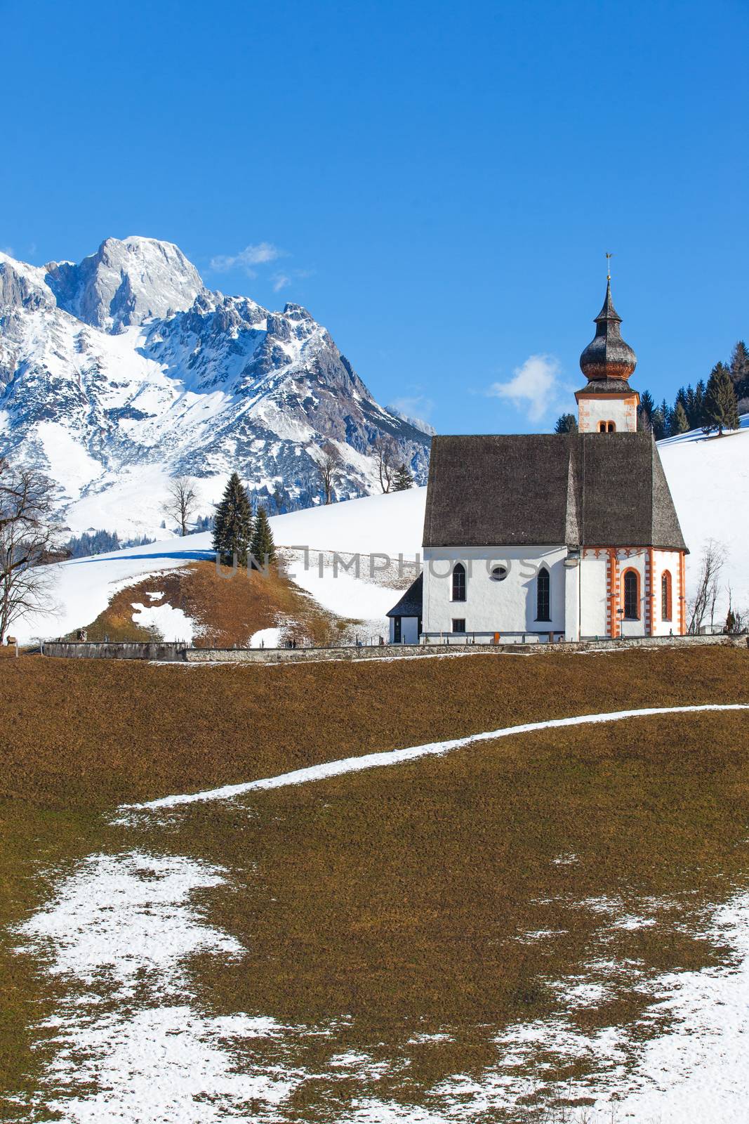 Beautiful winter view of church in Austria. Vertical view