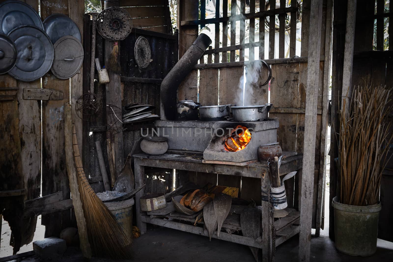 This is the Traditional Kitchen using wood for burning in Bentre province, MeKong delta, Vietnam, SouthEast Asia