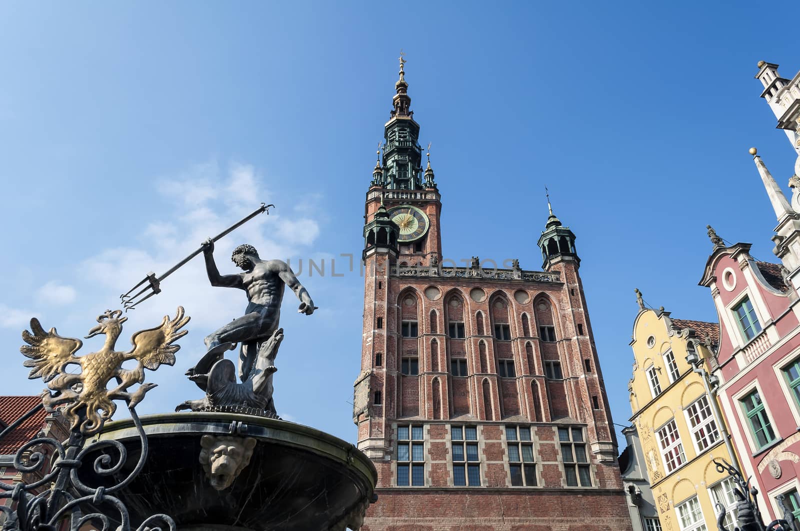 City hall building and Neptune's fountain in the Old Town of Gdansk, Poland. 