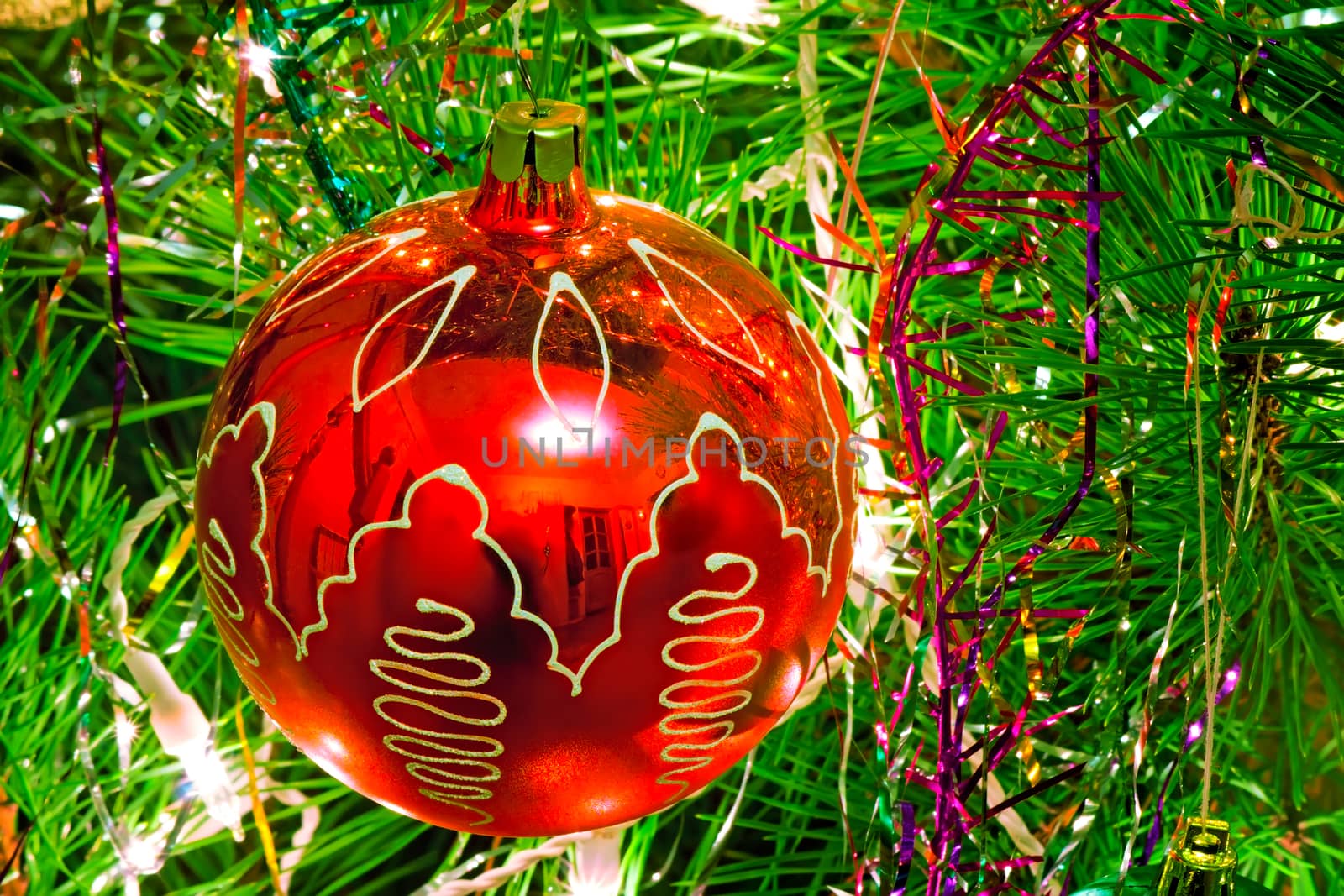 Shiny lights and nice red ball - ornaments for a Christmas tree