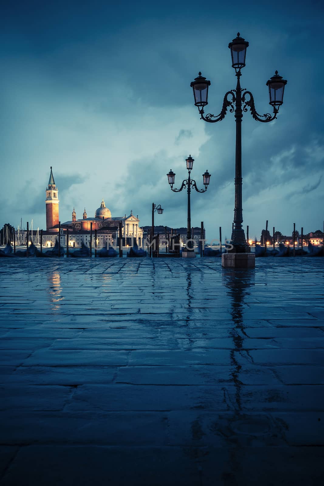 Gondolas floating in the Grand Canal on a rainy day 