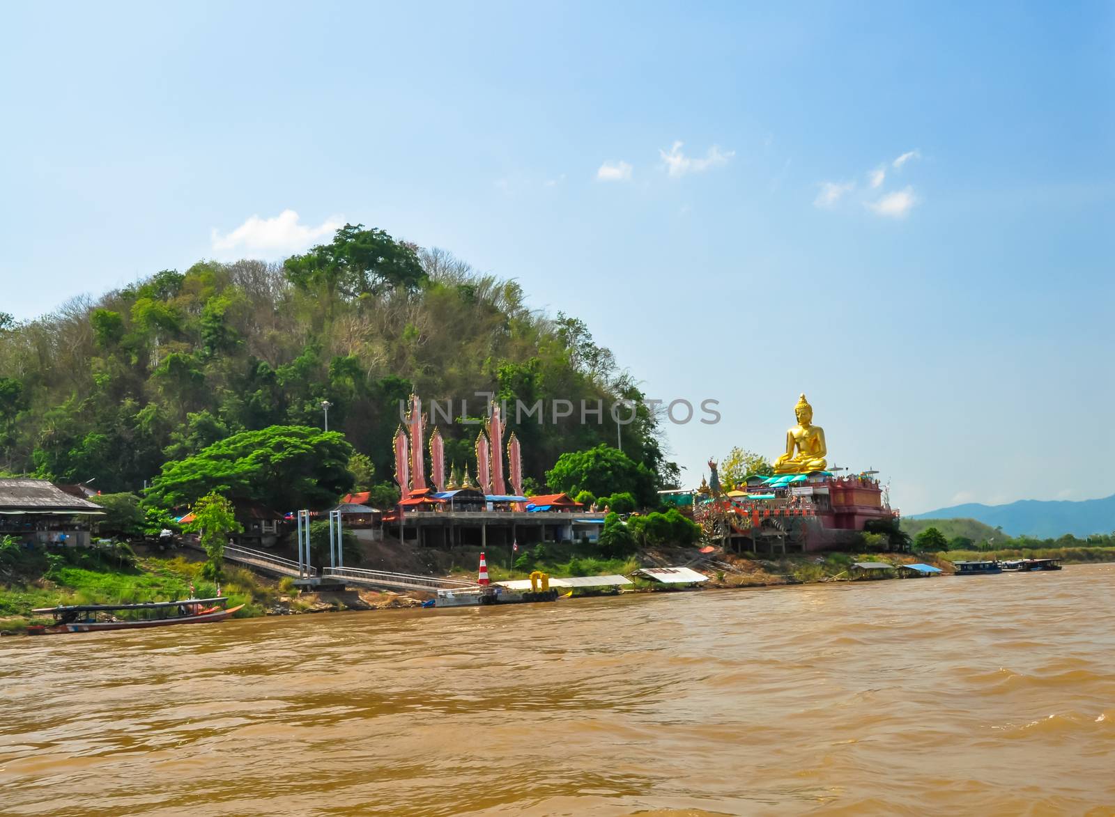 Beautiful Golden Buddha statue, at public temple, Wat Phabuddha navarantur - Golden Triangle in Chiang Rai,Thailand.