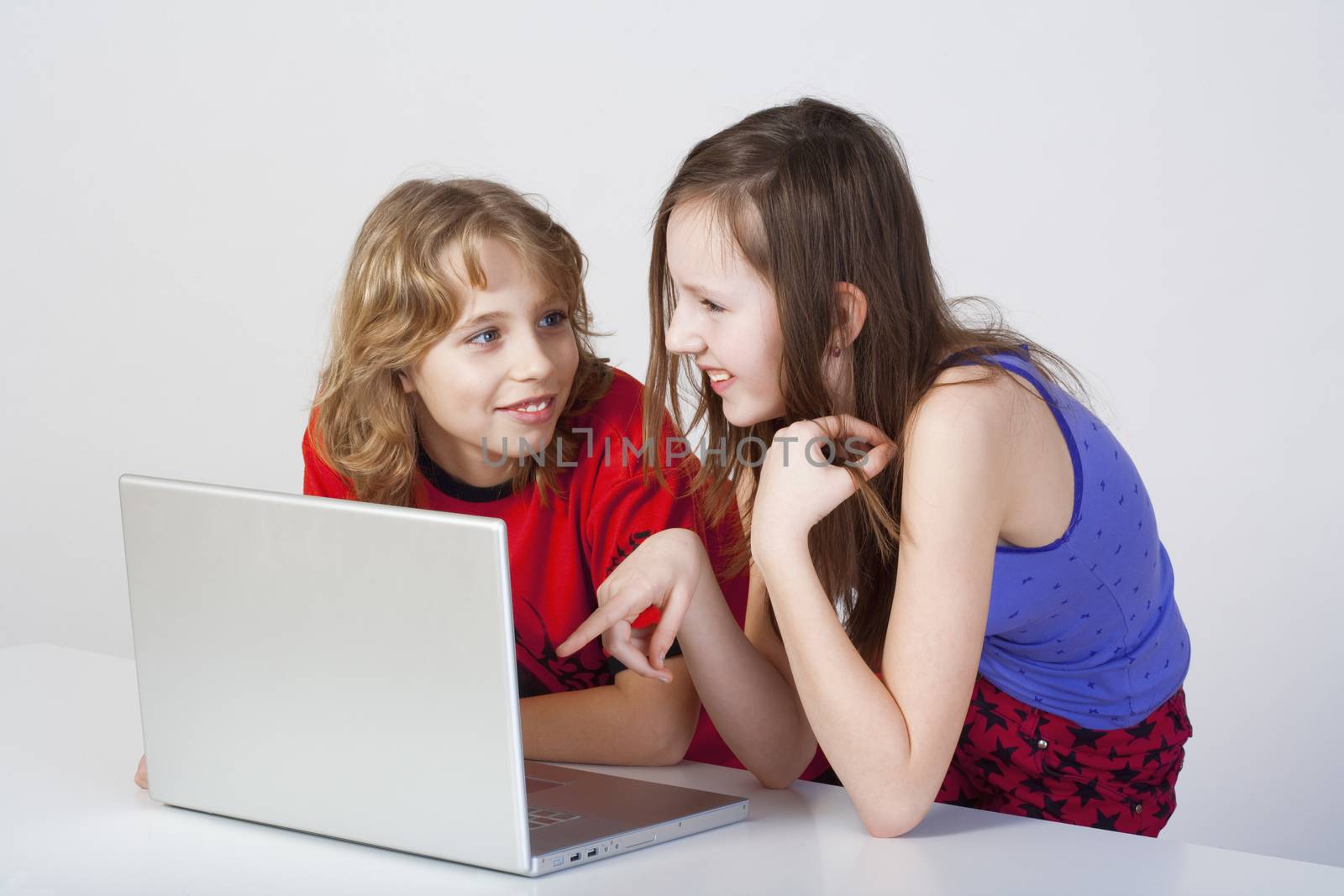 boy and girl with laptop by courtyardpix