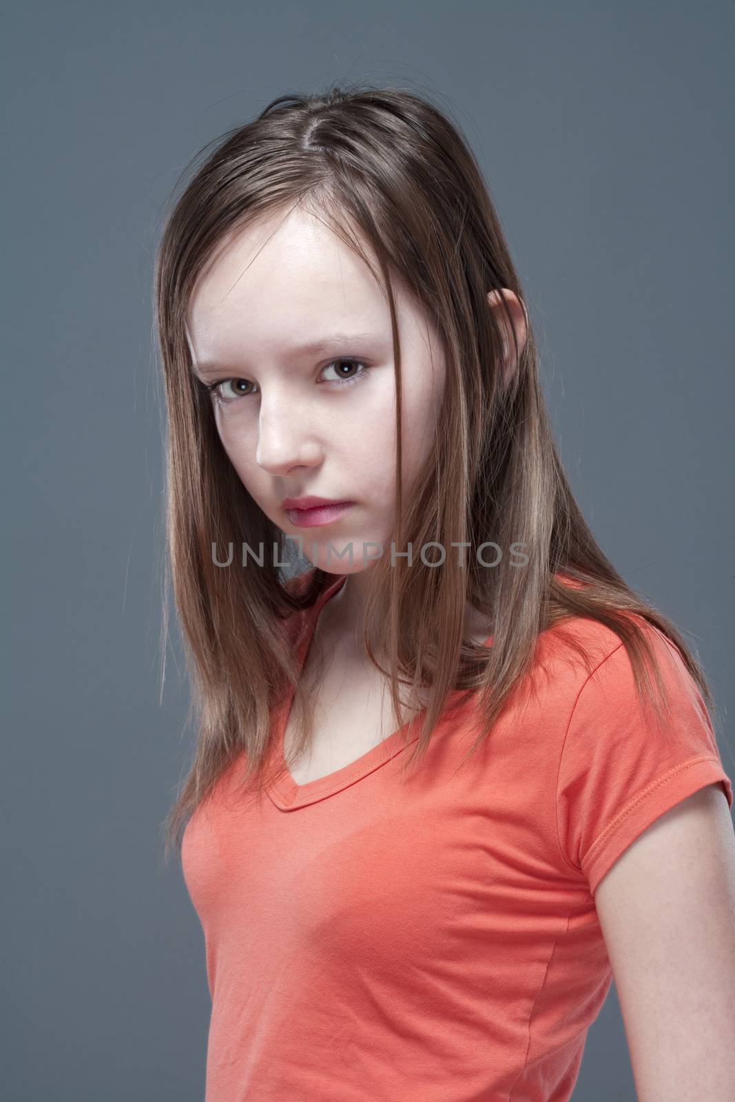 studio portrait of a pretty, eleven years old girl