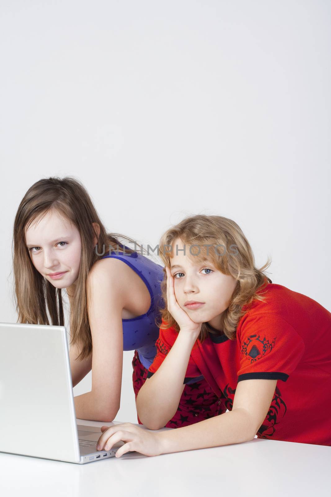 young boy and girl having fun with laptop computer