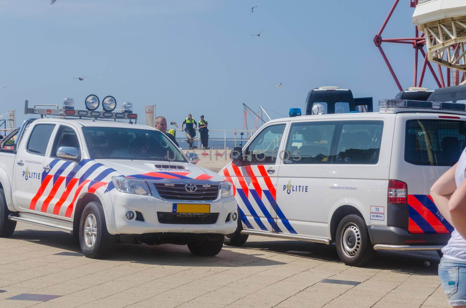 Den Haag,Scheveningen Pier, Niederlande - August 07. 2014: Occupation and protest by squatters on Thursday morning 07.2014. The pier was cleared of about 15 squatters by a police operation and the attached banners were removed. 
Der1961 opened Pier was closed in December 2012 because he did not meet the safety requirements. Since then, an investor / buyer is sought.