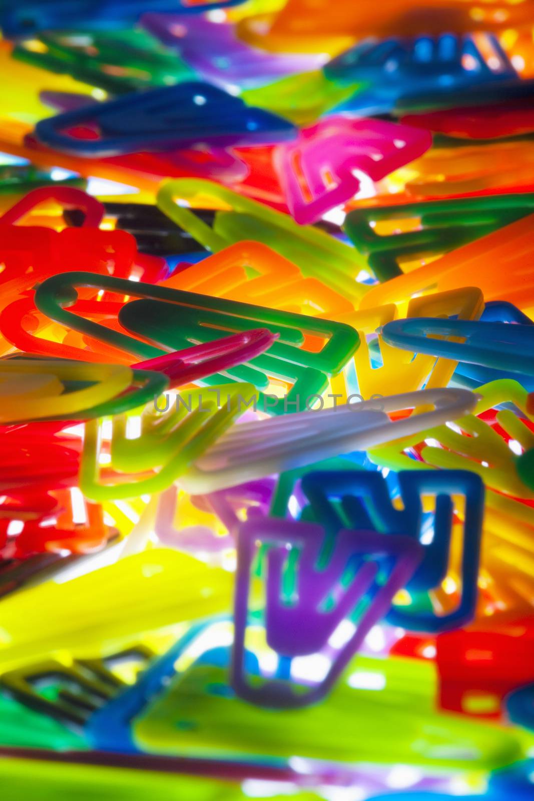 stationery - closeup oof many colorful plastic clips