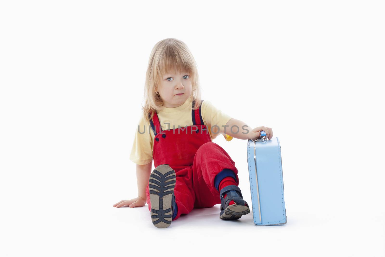 boy with long blond hair and suitcase isolated on white