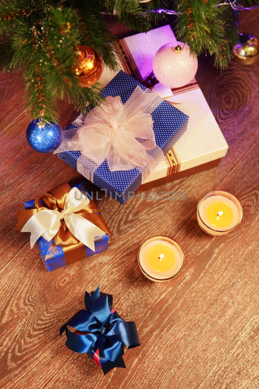 Christmas gift boxes in the interior with two candle